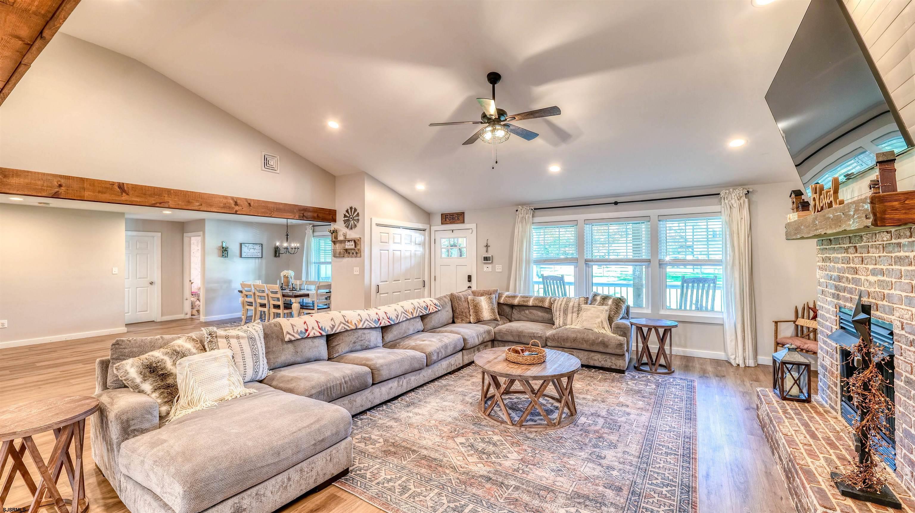 130 Stage Road Little Egg Harbor, NJ 08087 - Photo 12 of 50 a living room with furniture and a large window