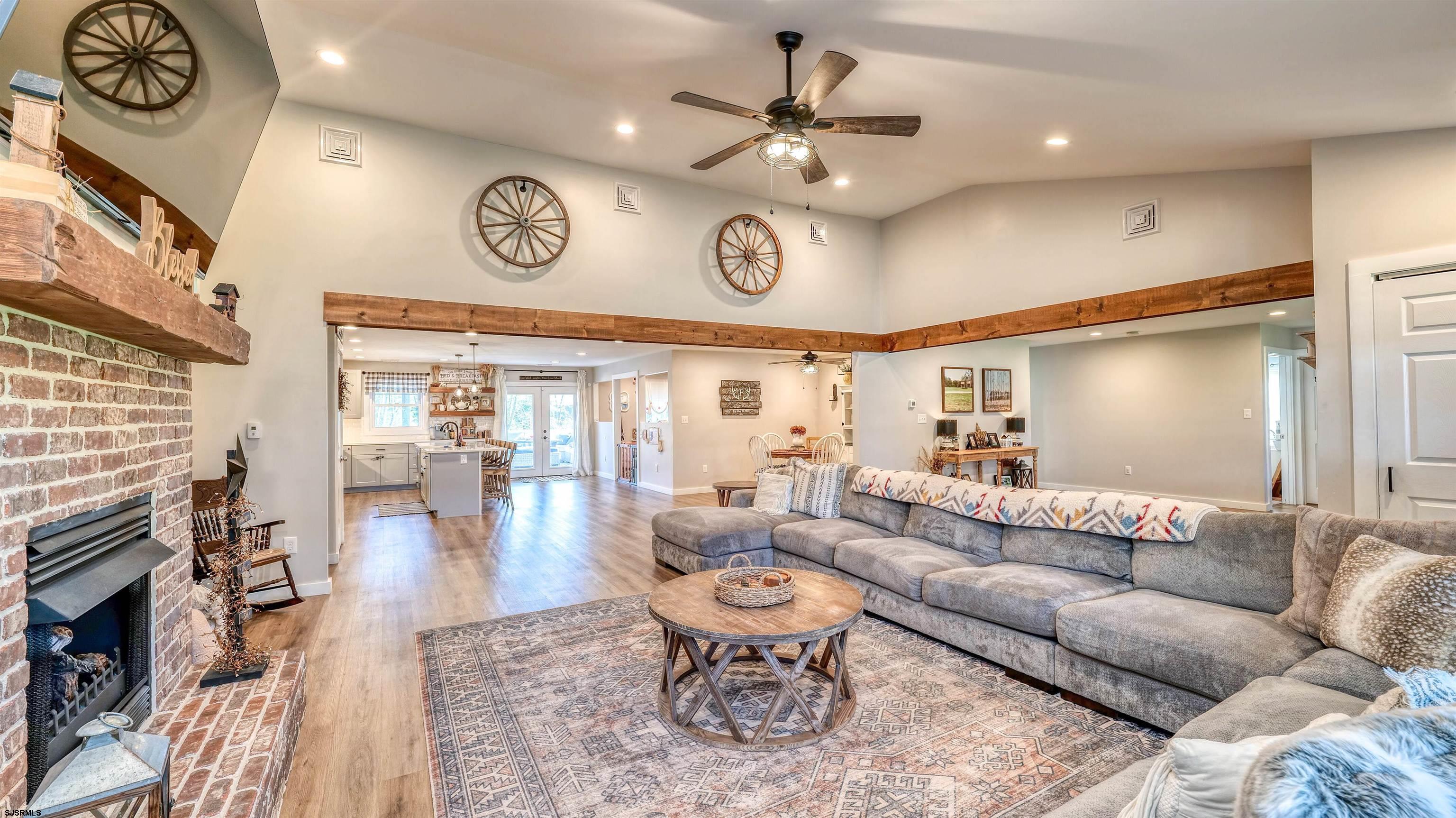 130 Stage Road Little Egg Harbor, NJ 08087 - Photo 13 of 50 a living room with furniture a clock and a rug