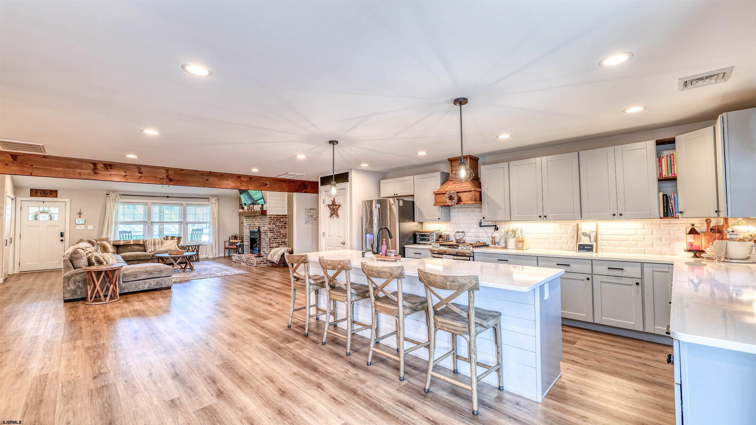 130 Stage Road Little Egg Harbor, NJ 08087 - Photo 16 of 50 a large kitchen with lots of counter space wooden floor and appliances