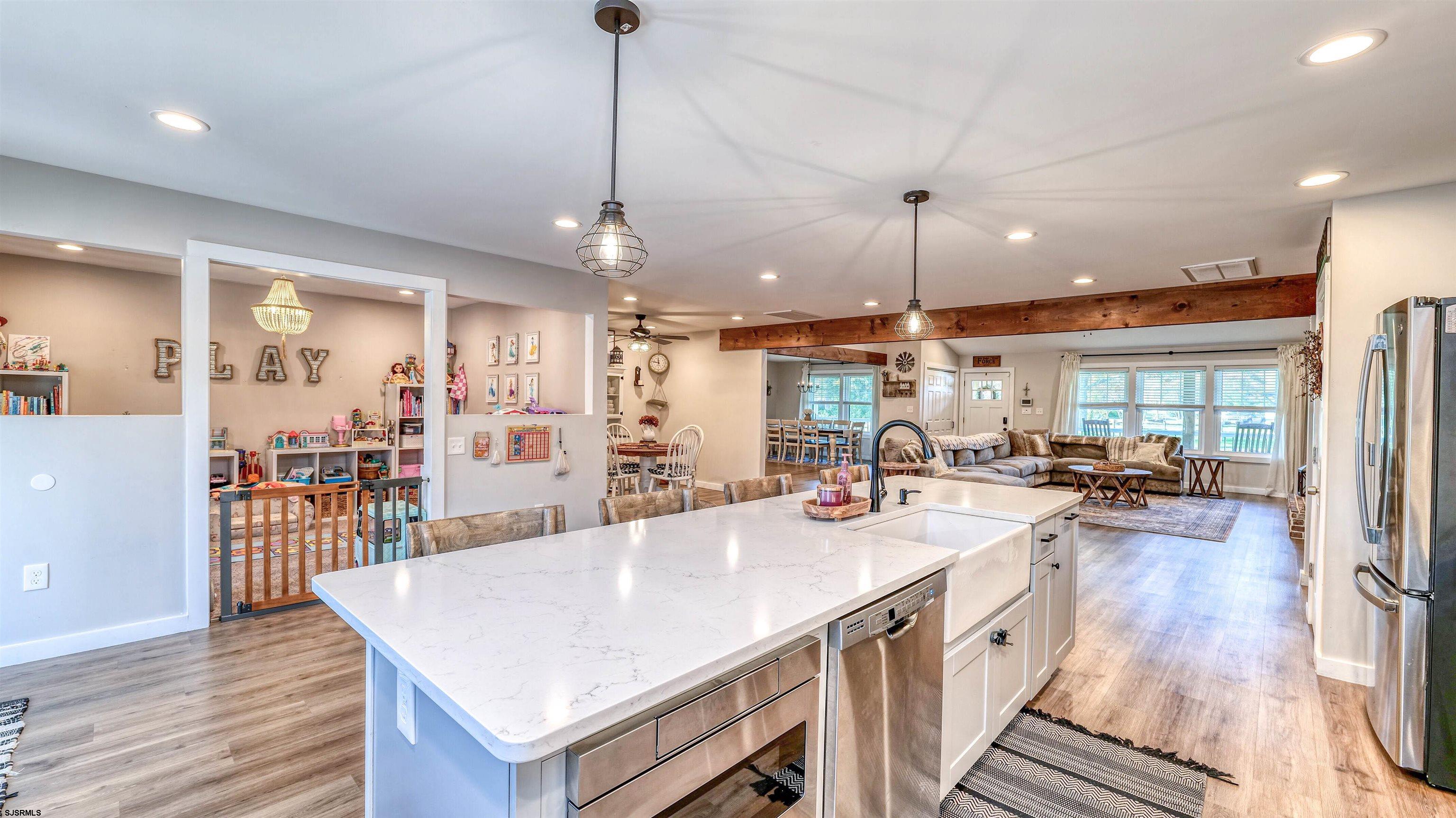 130 Stage Road Little Egg Harbor, NJ 08087 - Photo 17 of 50 a large kitchen with kitchen island a large island in it