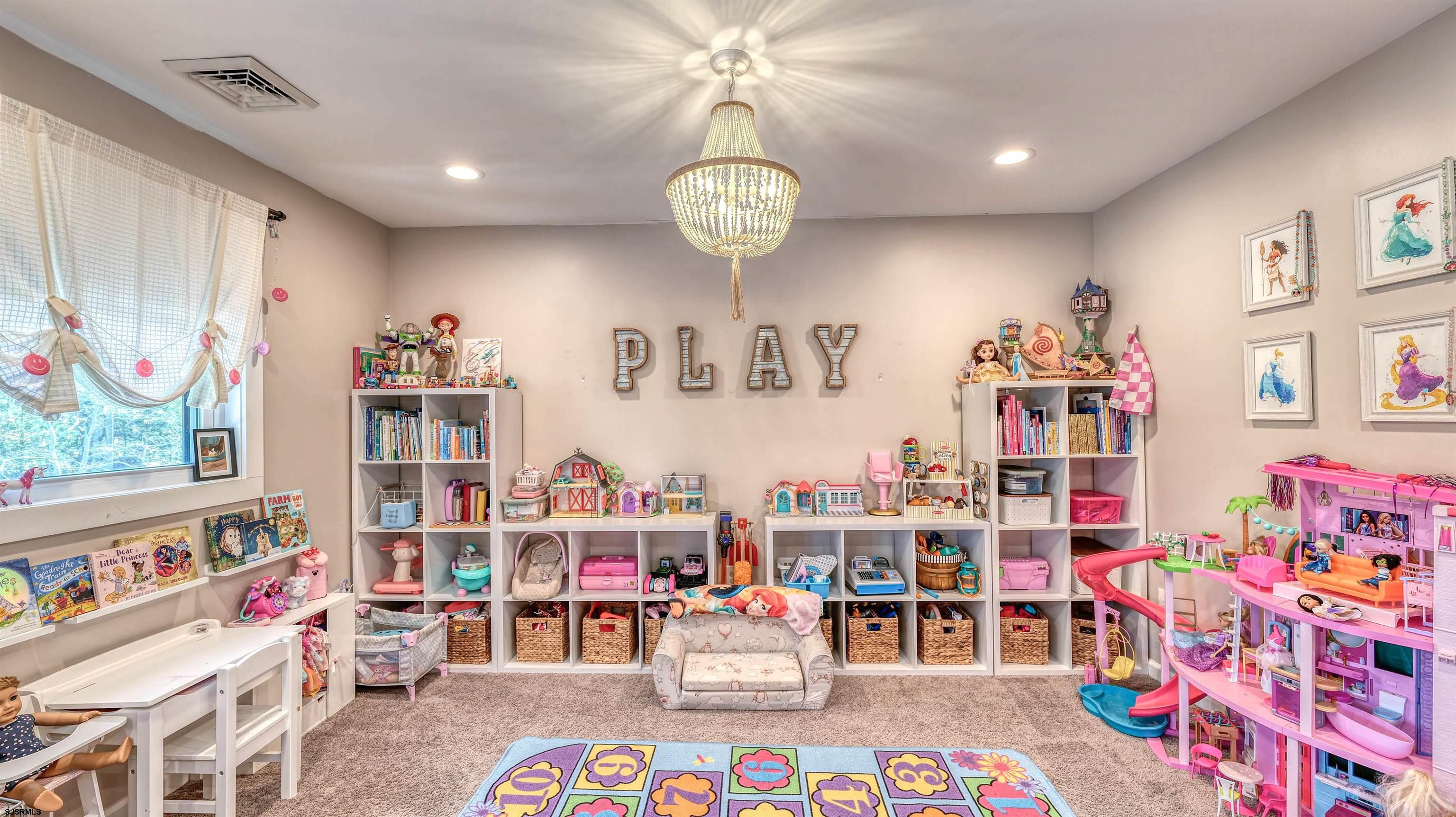 130 Stage Road Little Egg Harbor, NJ 08087 - Photo 19 of 50 a room with furniture and a book shelf