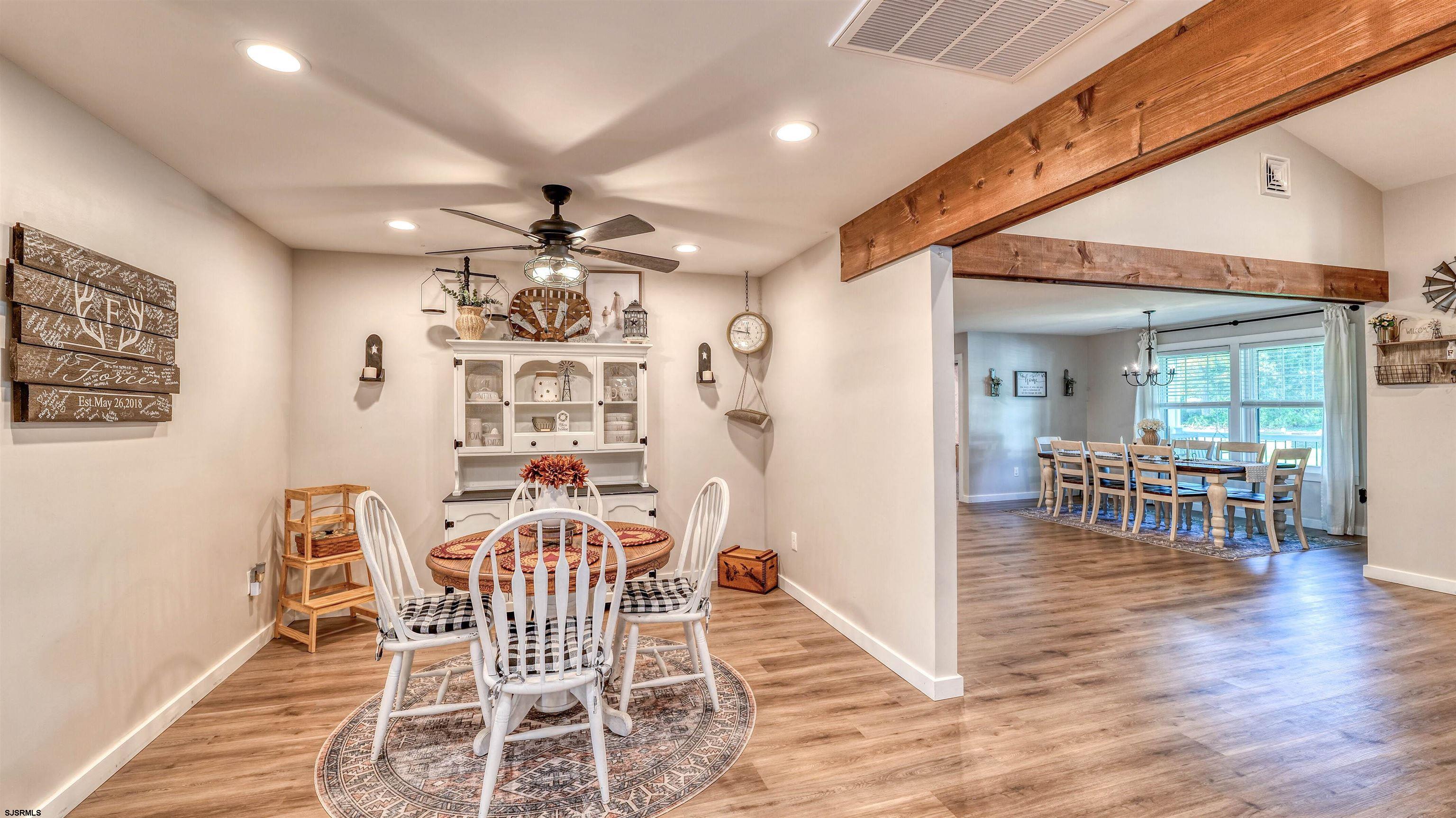 130 Stage Road Little Egg Harbor, NJ 08087 - Photo 20 of 50 a view of a dining room with furniture and wooden floor