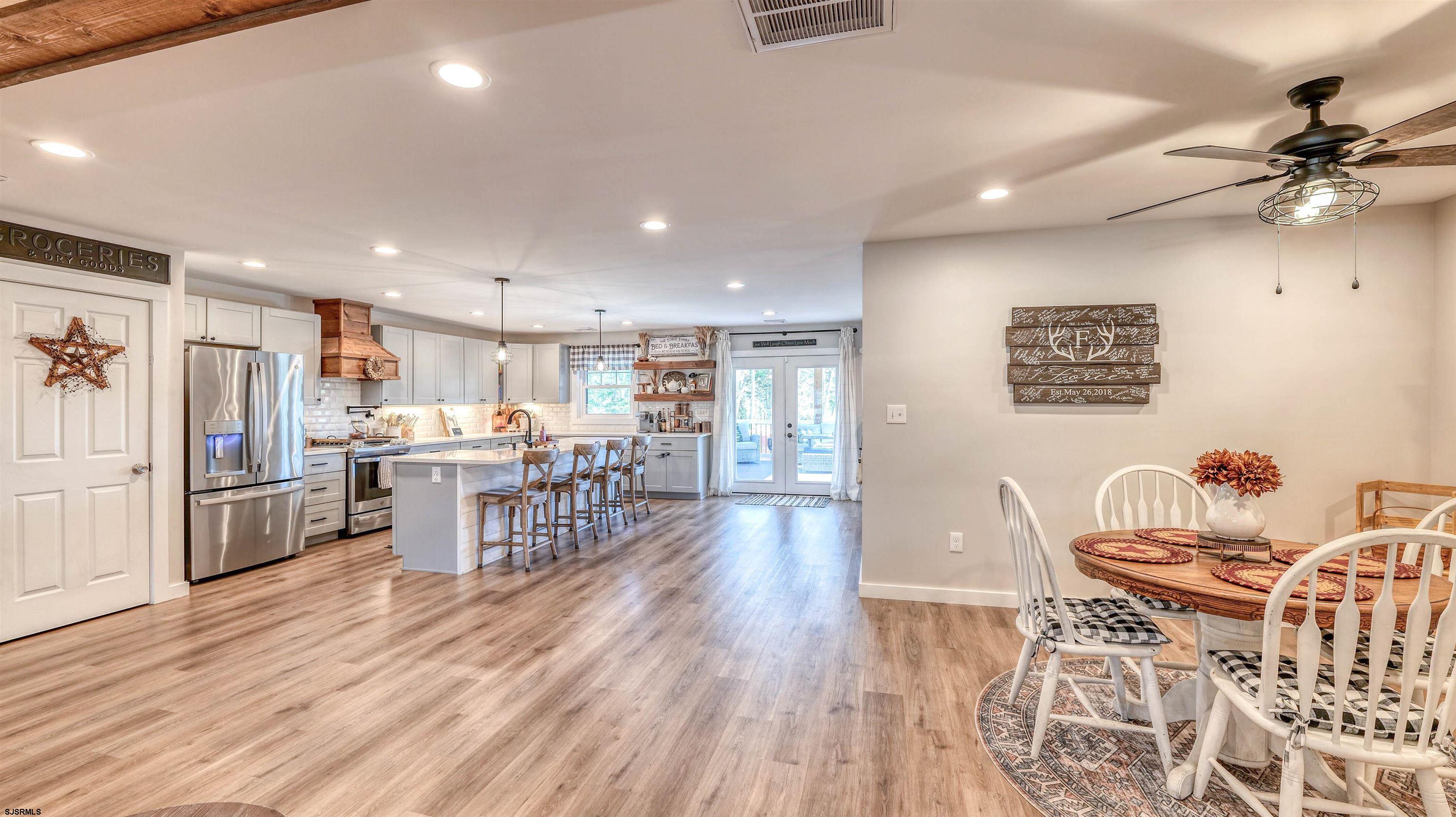130 Stage Road Little Egg Harbor, NJ 08087 - Photo 21 of 50 a living room with furniture a table and chairs