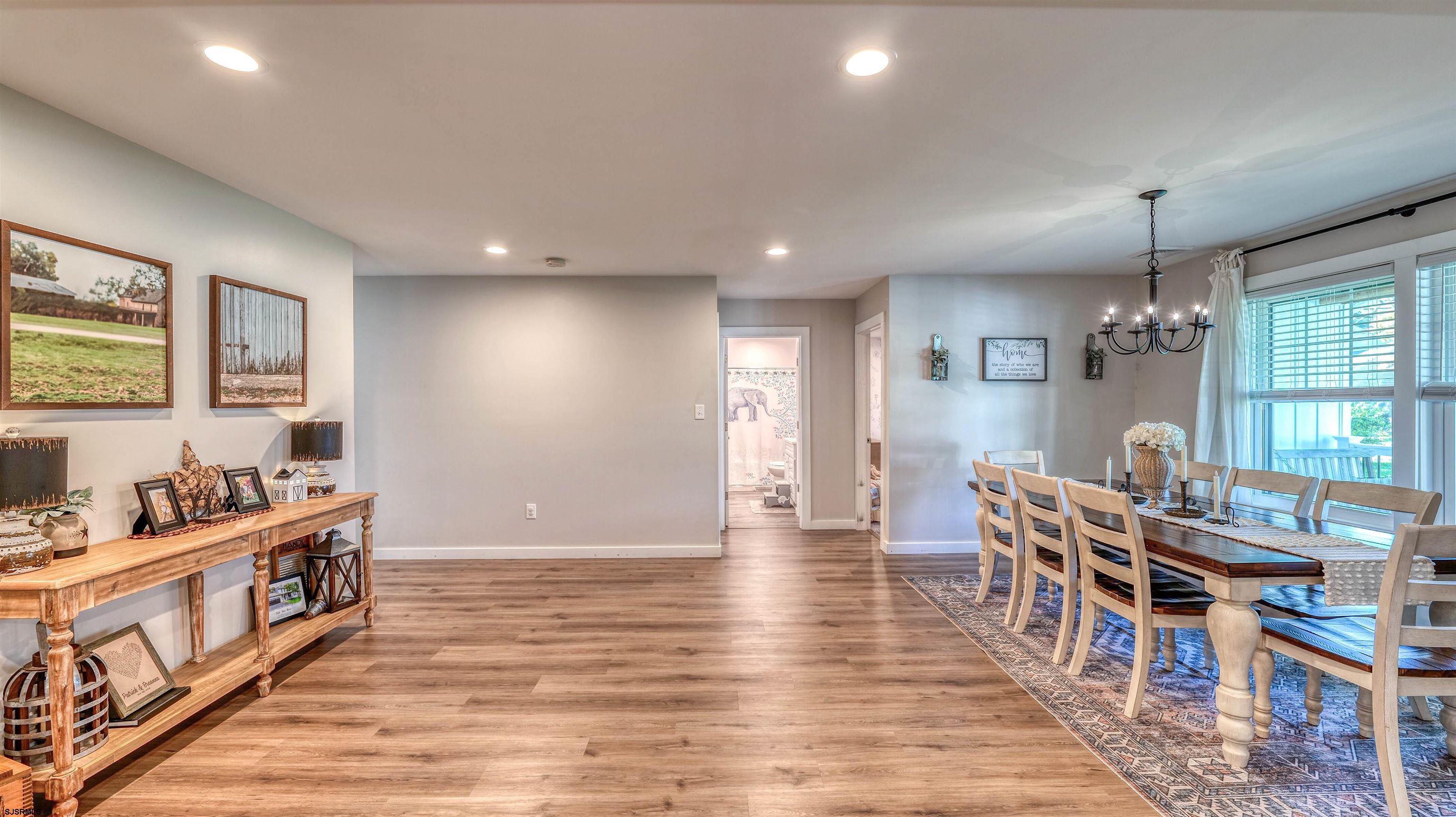 130 Stage Road Little Egg Harbor, NJ 08087 - Photo 22 of 50 a living room with furniture and a wooden floor