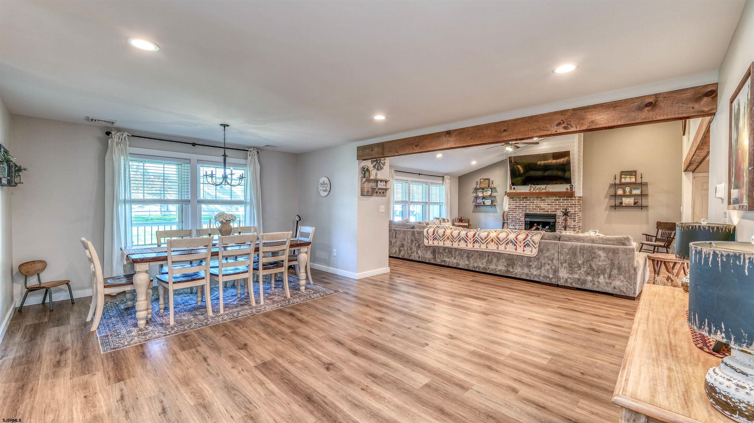 130 Stage Road Little Egg Harbor, NJ 08087 - Photo 23 of 50 a living room with furniture and a wooden floor