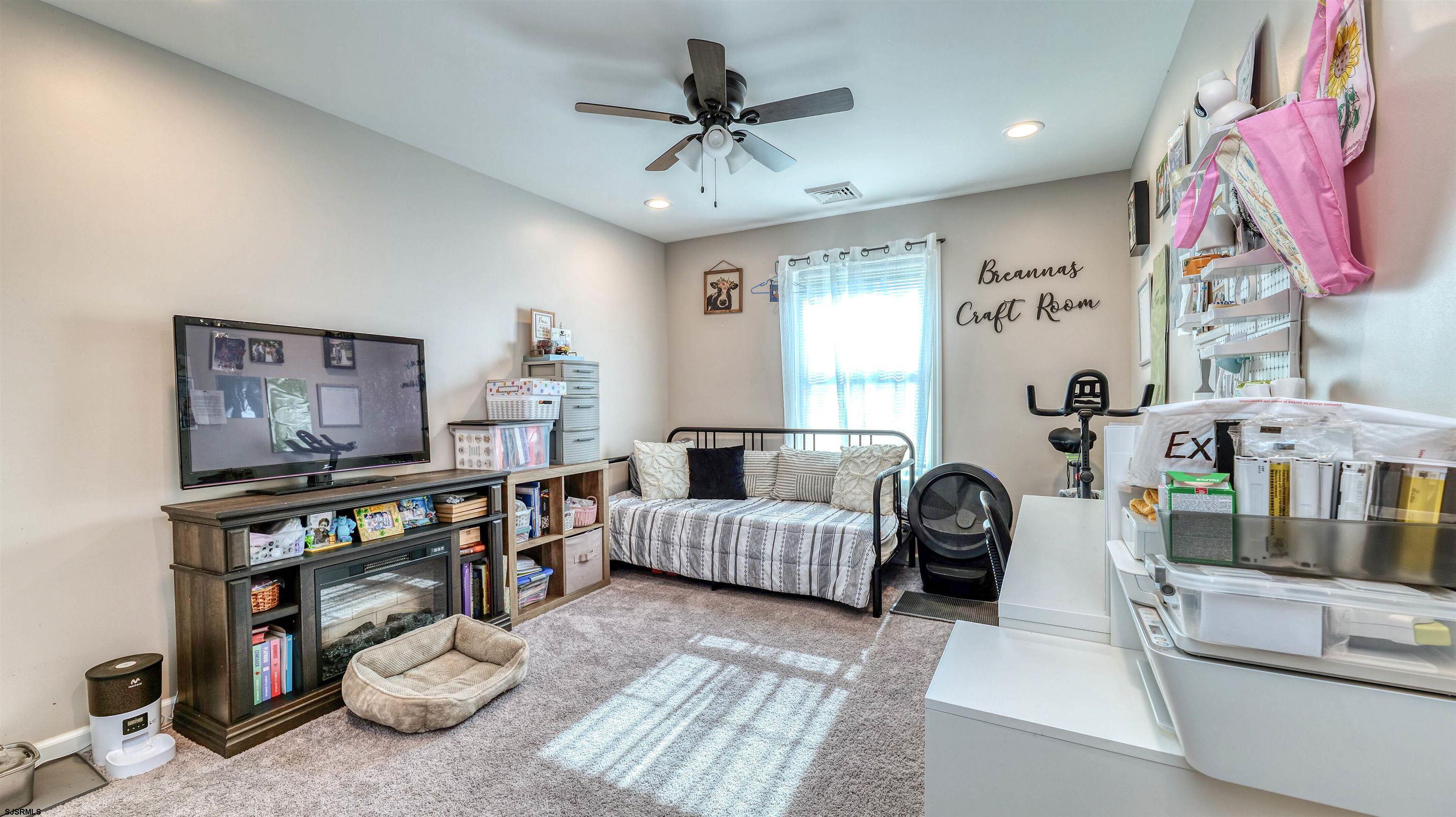 130 Stage Road Little Egg Harbor, NJ 08087 - Photo 27 of 50 a bedroom with furniture and a book shelf