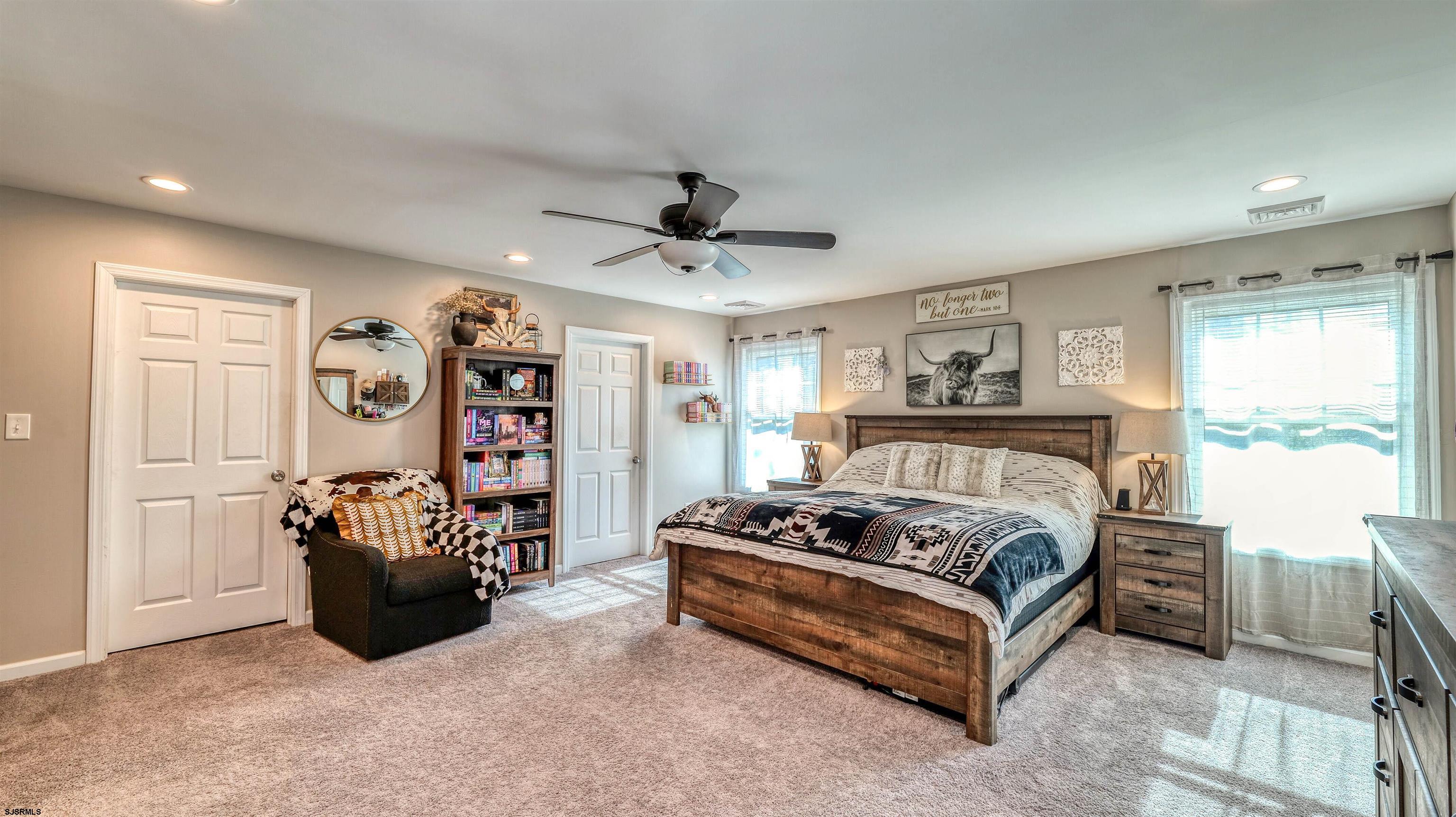 130 Stage Road Little Egg Harbor, NJ 08087 - Photo 28 of 50 a spacious bedroom with a bed and a ceiling fan