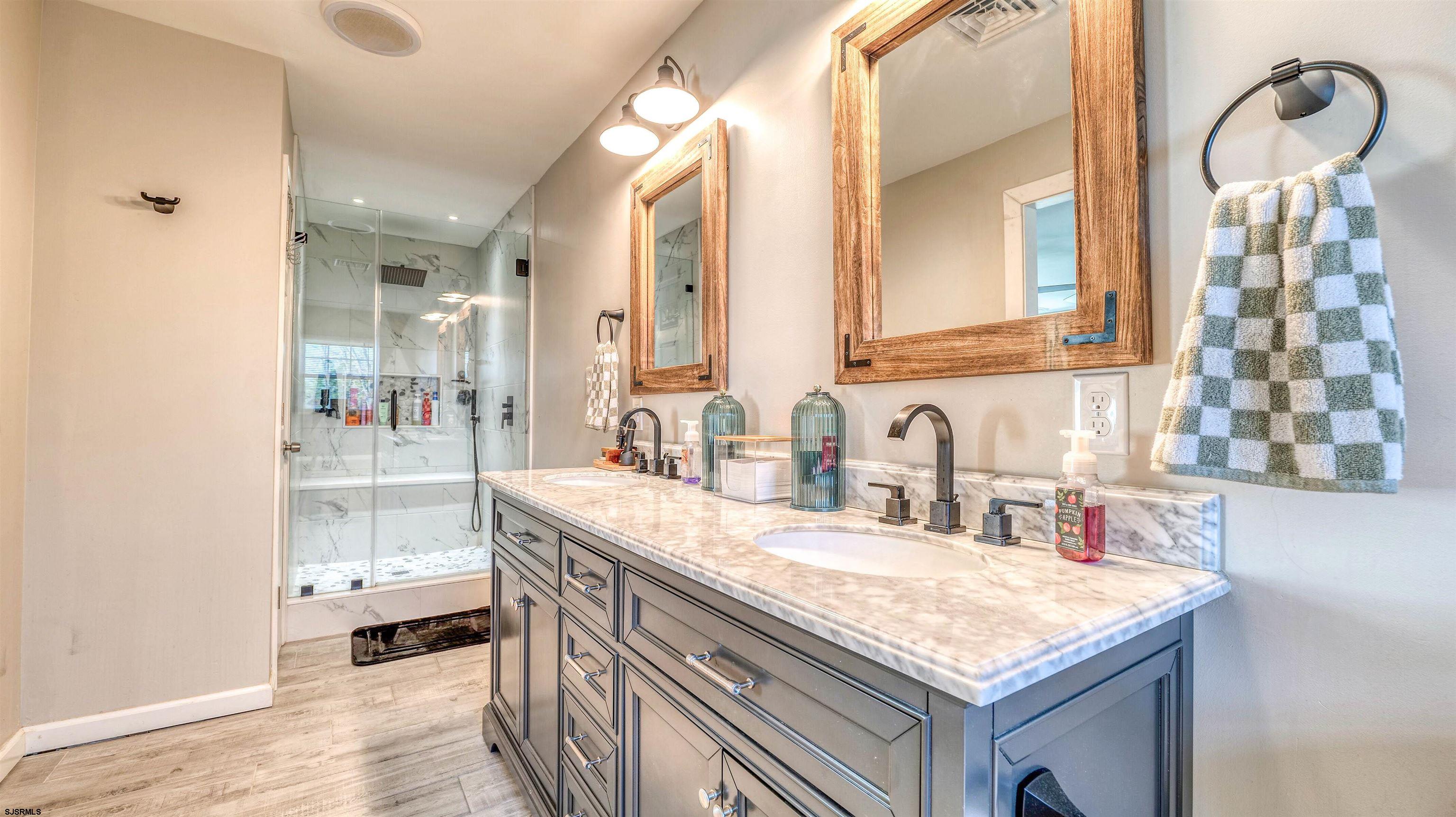 130 Stage Road Little Egg Harbor, NJ 08087 - Photo 33 of 50 a bathroom with a granite countertop sink and a mirror