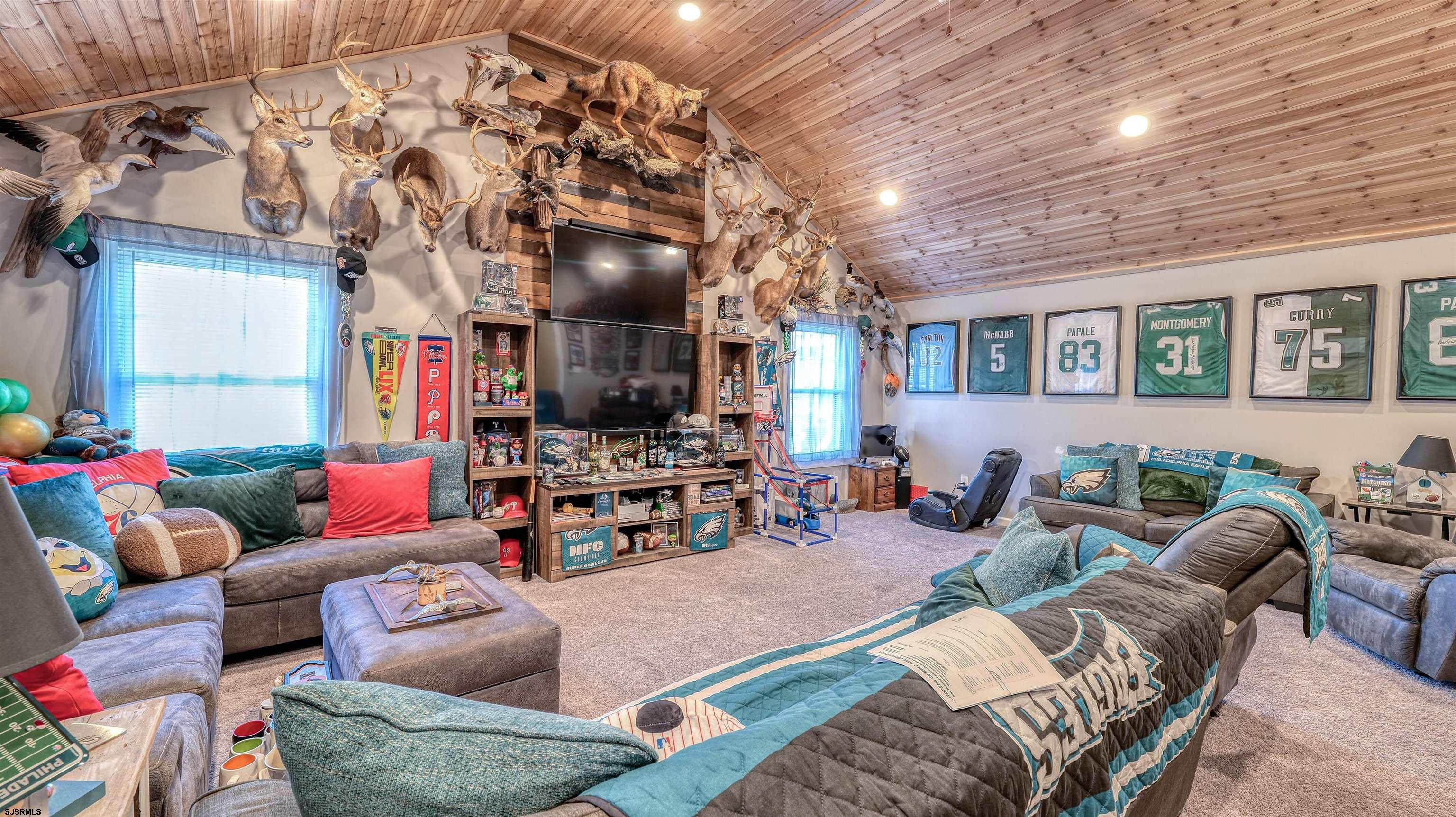 130 Stage Road Little Egg Harbor, NJ 08087 - Photo 38 of 50 a living room with furniture and a flat screen tv