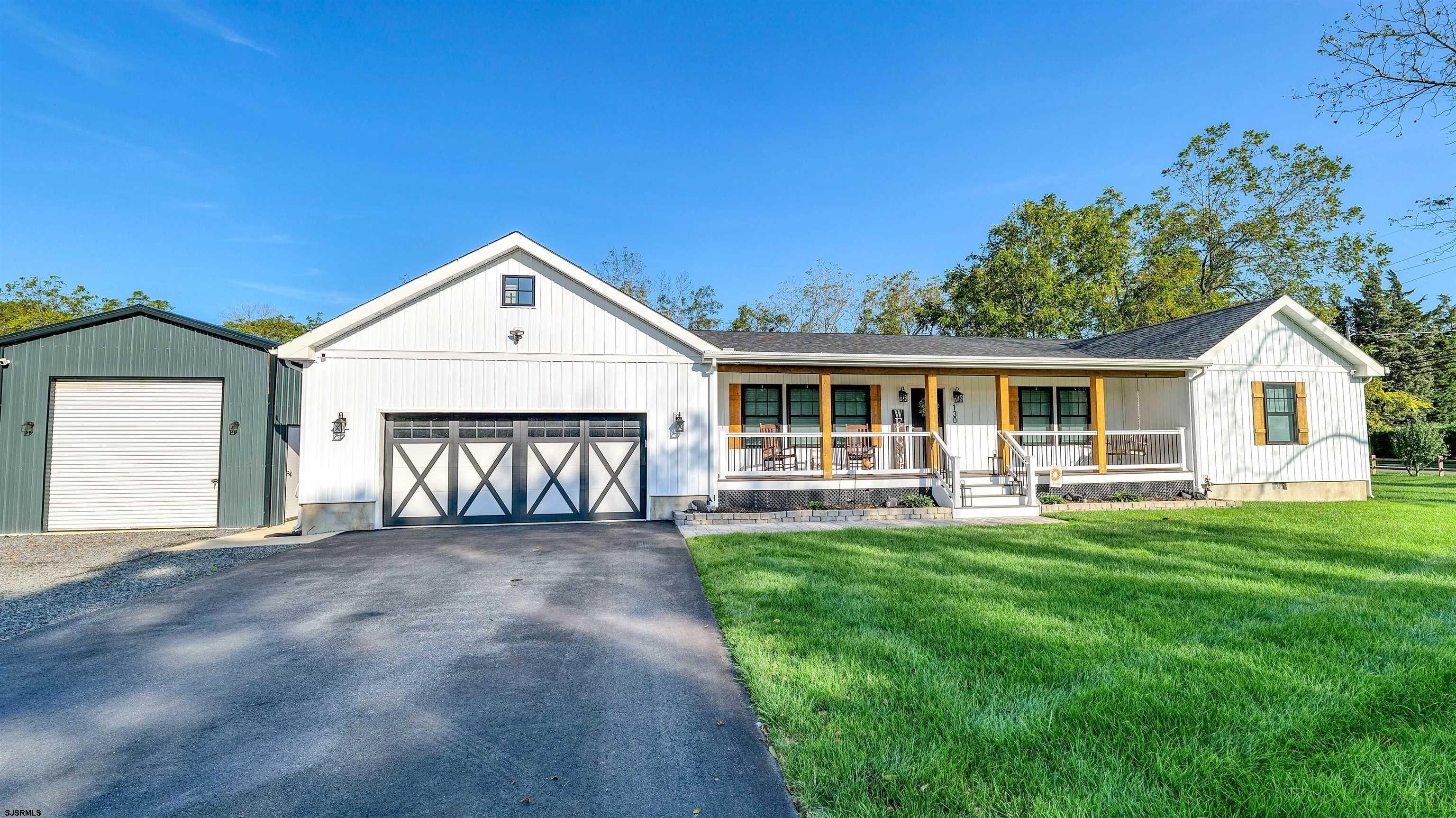 130 Stage Road Little Egg Harbor, NJ 08087 - Photo 4 of 50 a front view of a house with a garden and porch