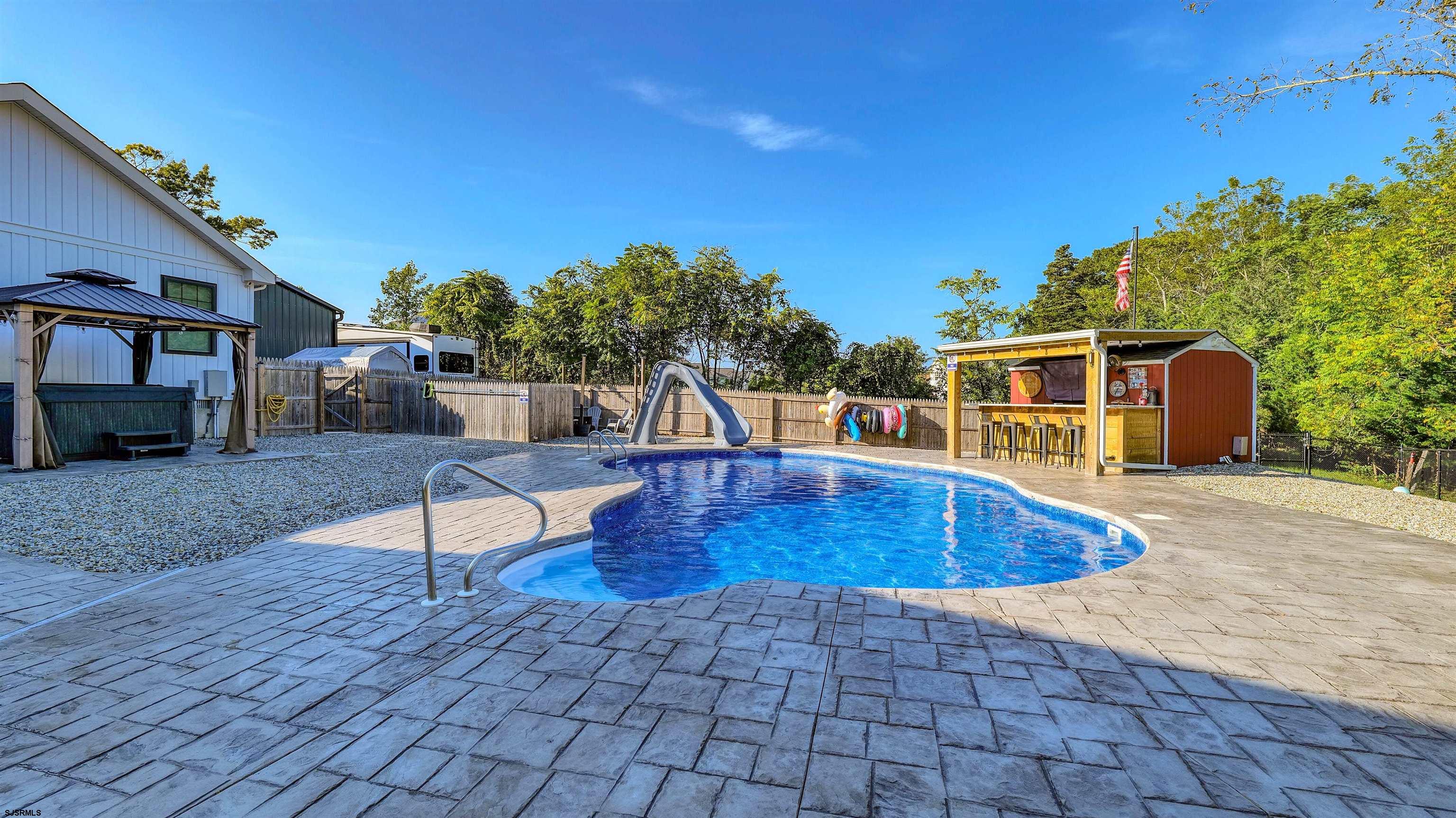 130 Stage Road Little Egg Harbor, NJ 08087 - Photo 43 of 50 a swimming pool with outdoor seating and yard