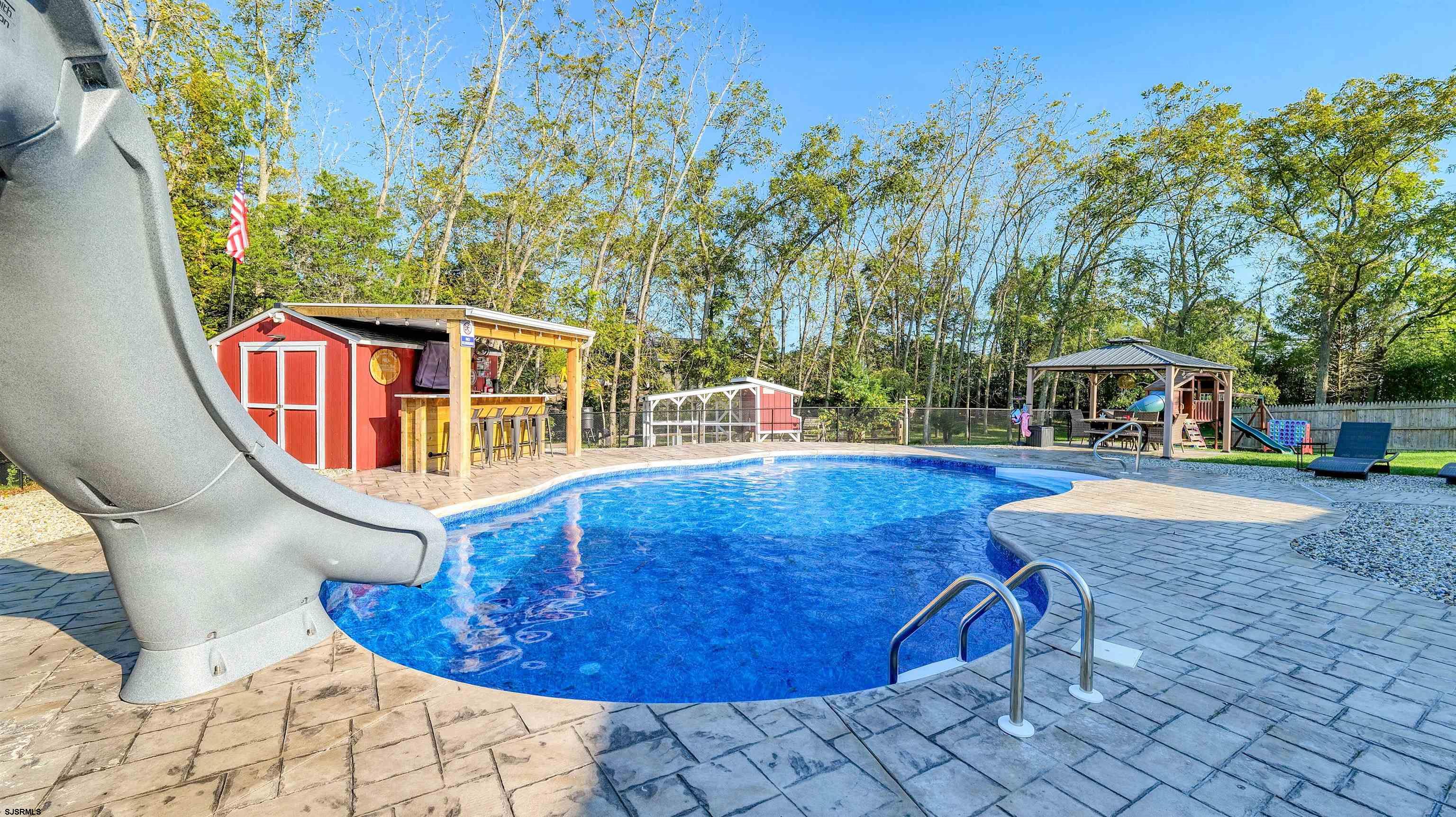 130 Stage Road Little Egg Harbor, NJ 08087 - Photo 45 of 50 a view of a swimming pool with lounge chair