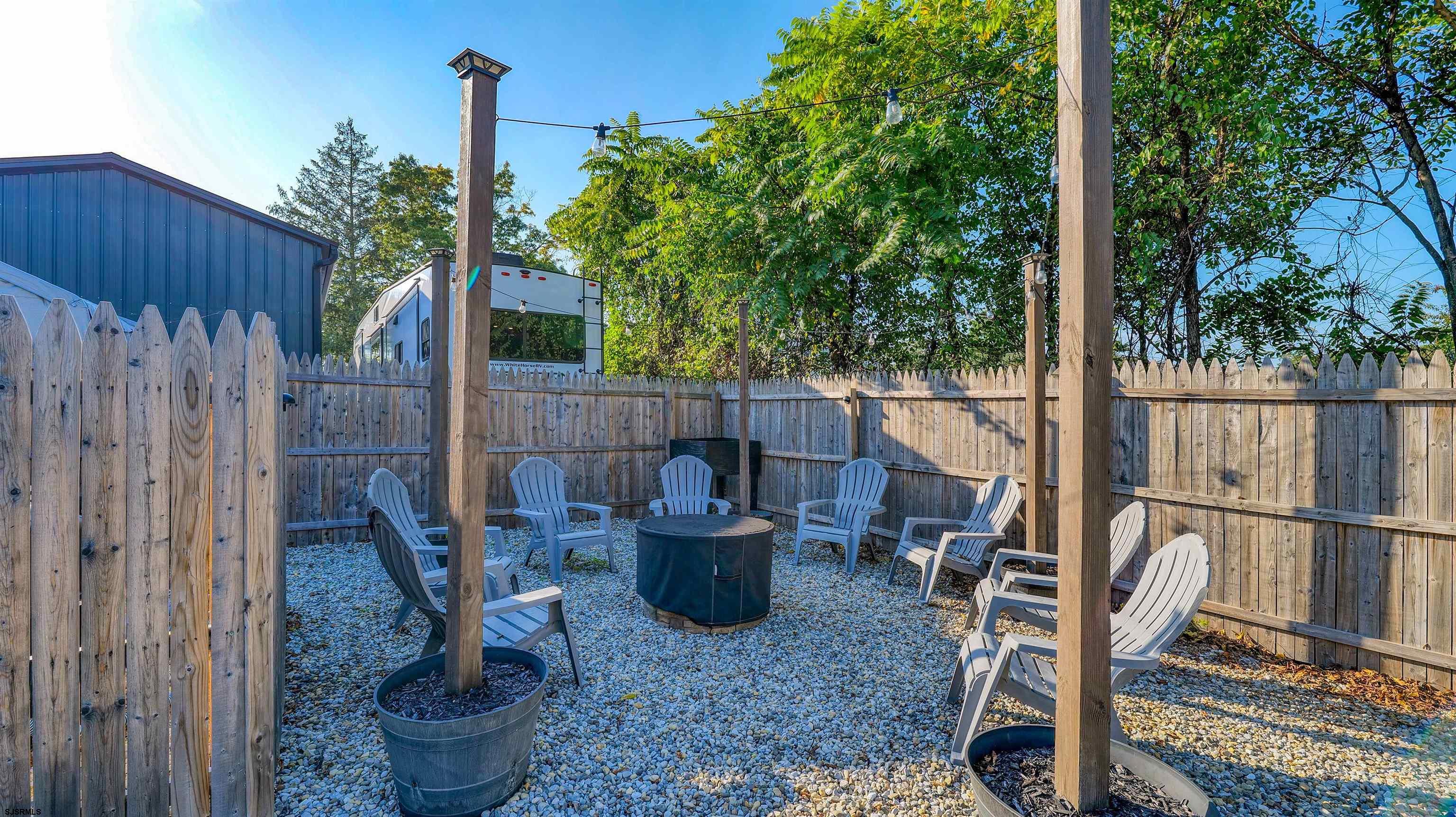 130 Stage Road Little Egg Harbor, NJ 08087 - Photo 49 of 50 a view of a porch with chairs and potted plants
