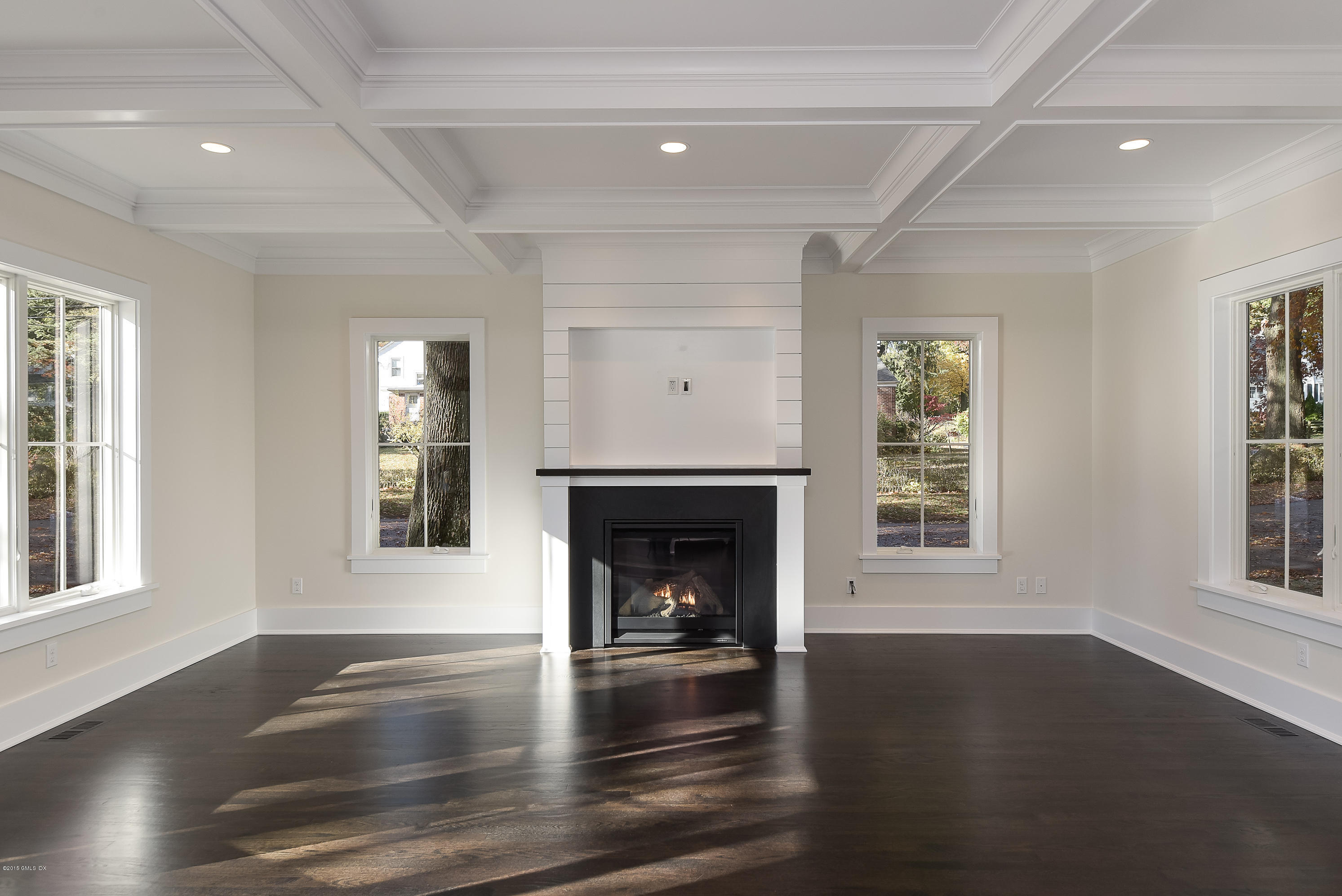30 Edgewood Road Darien, CT 06820 - Photo 11 of 28 a living room with fireplace and wooden floor