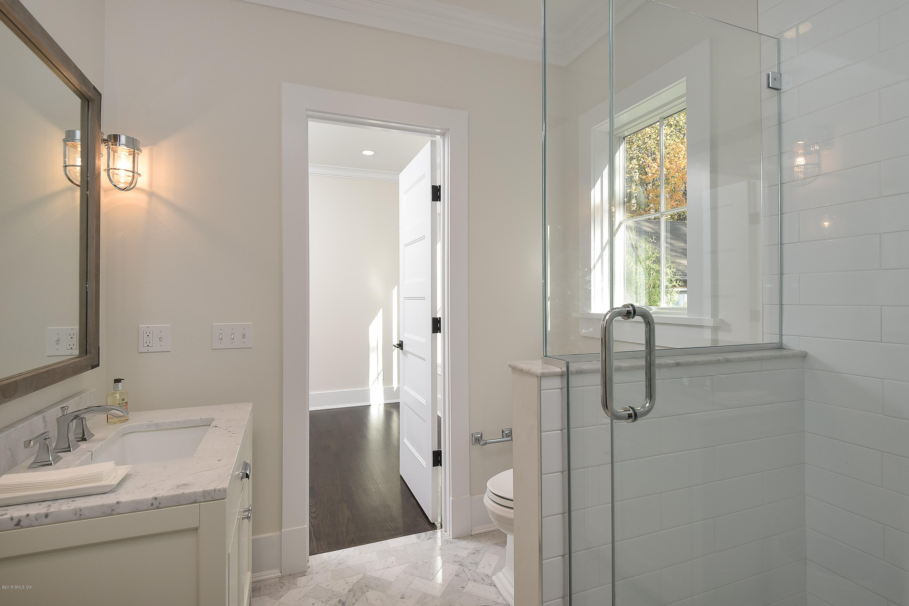 30 Edgewood Road Darien, CT 06820 - Photo 15 of 28 a bathroom with a granite countertop toilet sink and shower