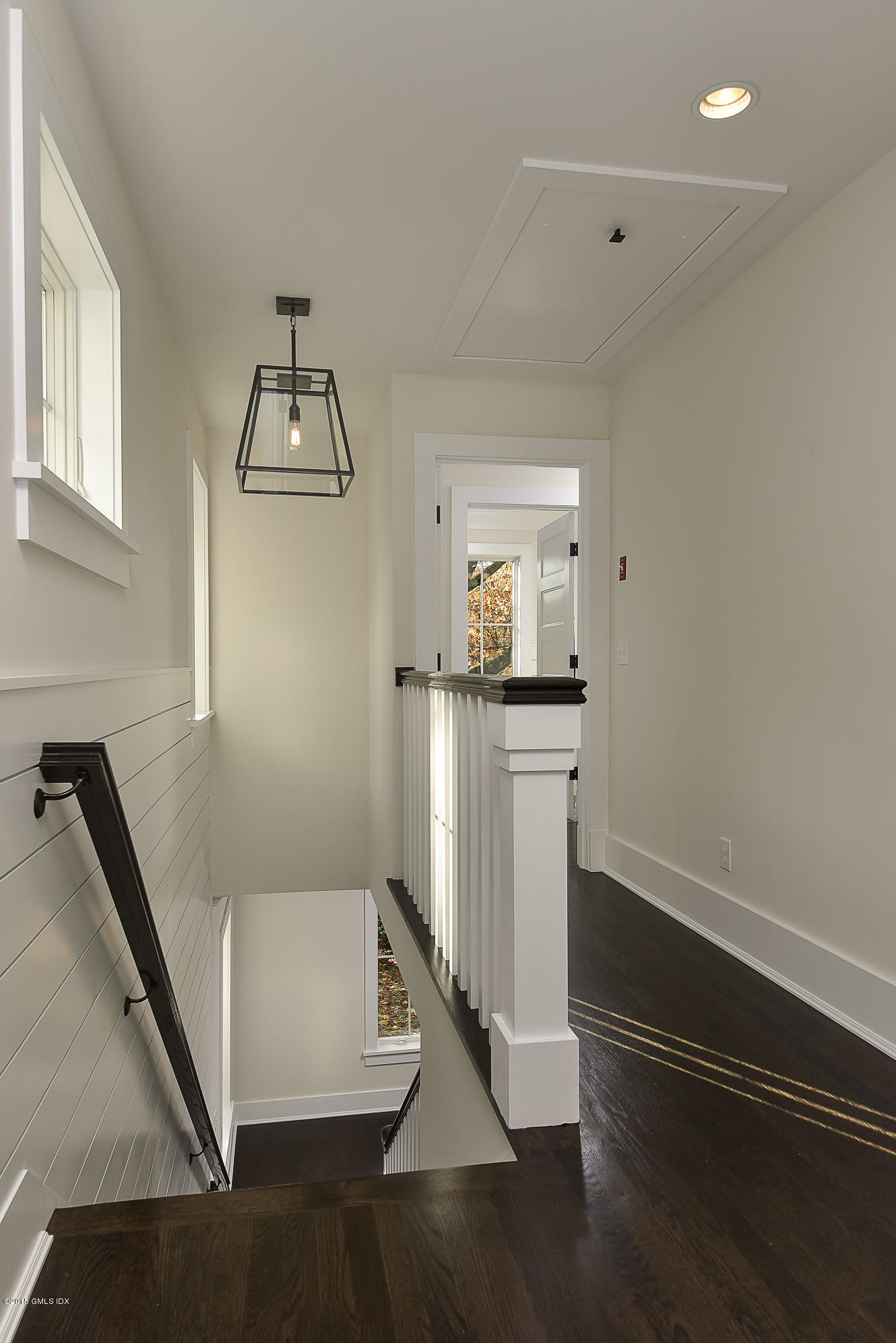30 Edgewood Road Darien, CT 06820 - Photo 17 of 28 a view of hallway with stairs and wooden floor
