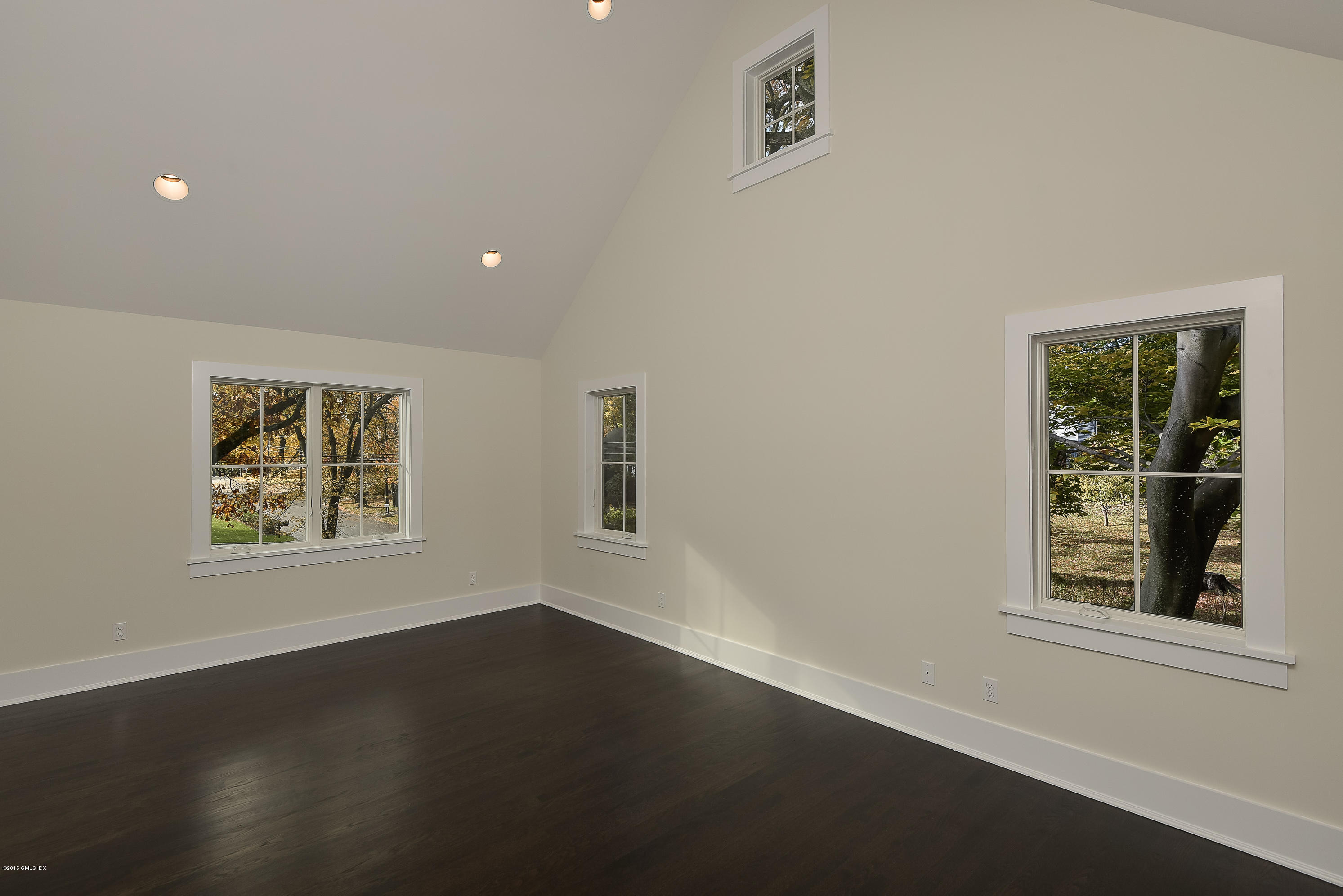 30 Edgewood Road Darien, CT 06820 - Photo 18 of 28 a view of an empty room with a window and wooden floor