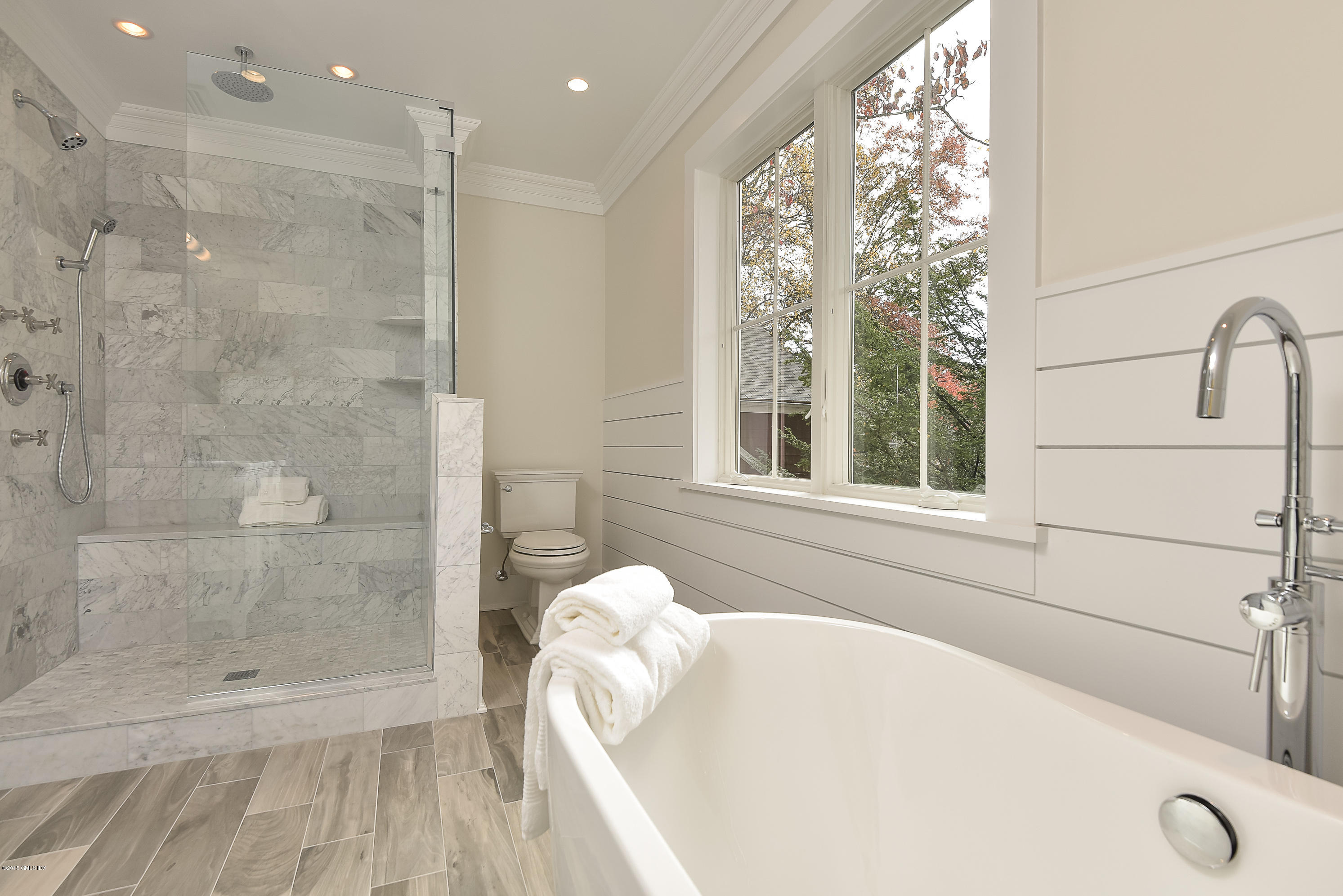 30 Edgewood Road Darien, CT 06820 - Photo 20 of 28 a bathroom with a bathtub and shower