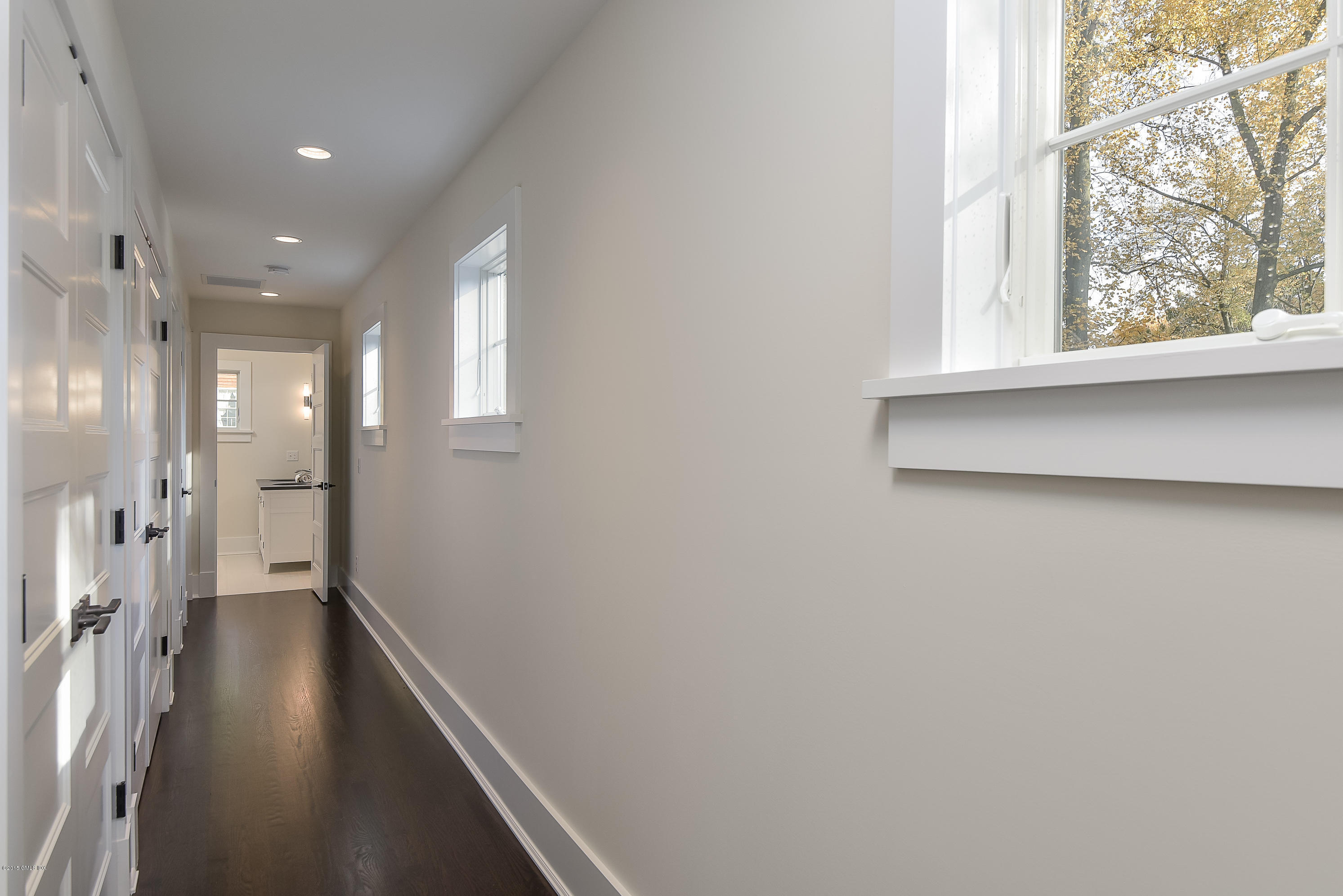 30 Edgewood Road Darien, CT 06820 - Photo 23 of 28 a view of hallway with a large window and wooden floor