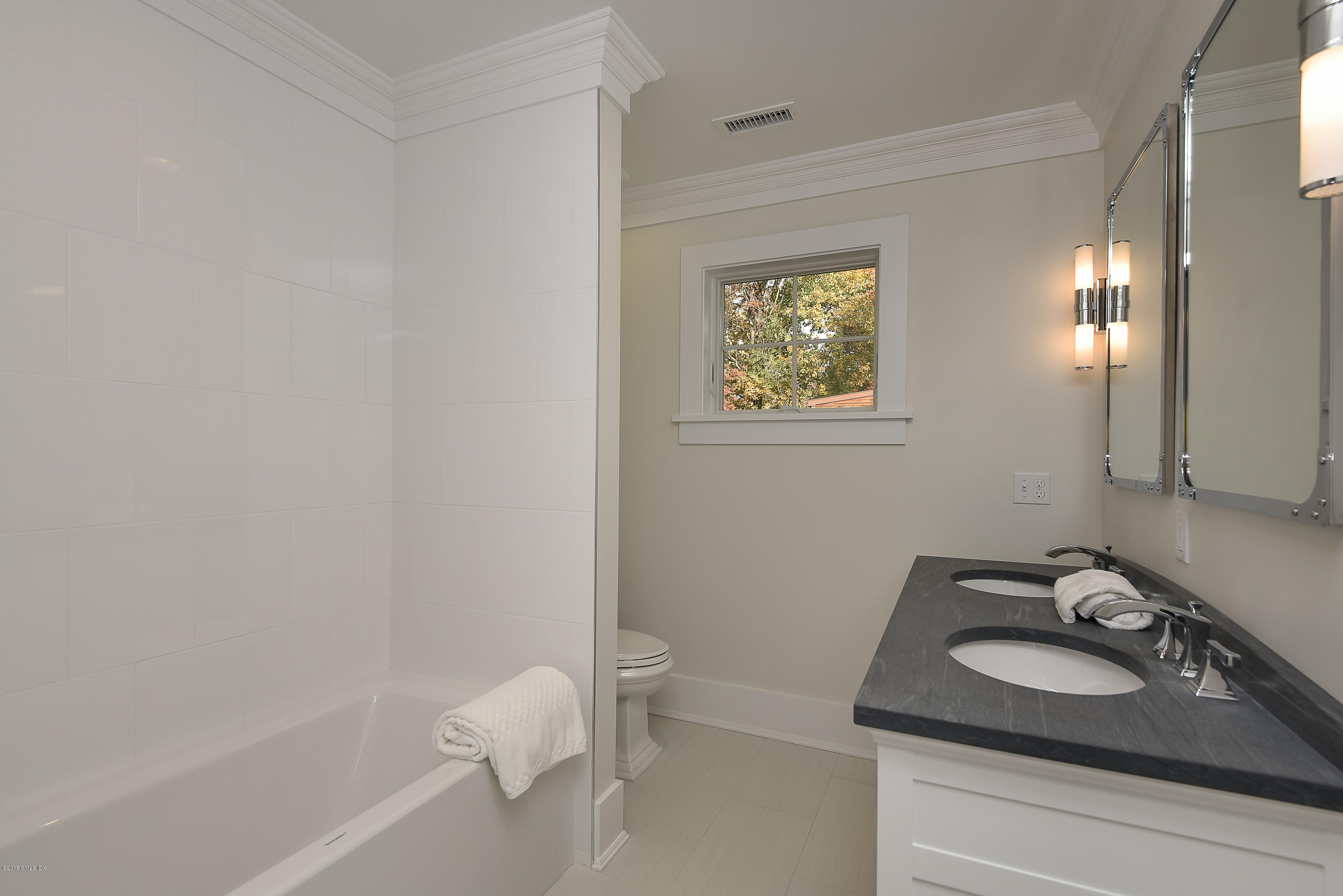 30 Edgewood Road Darien, CT 06820 - Photo 26 of 28 a bathroom with a sink toilet and shower