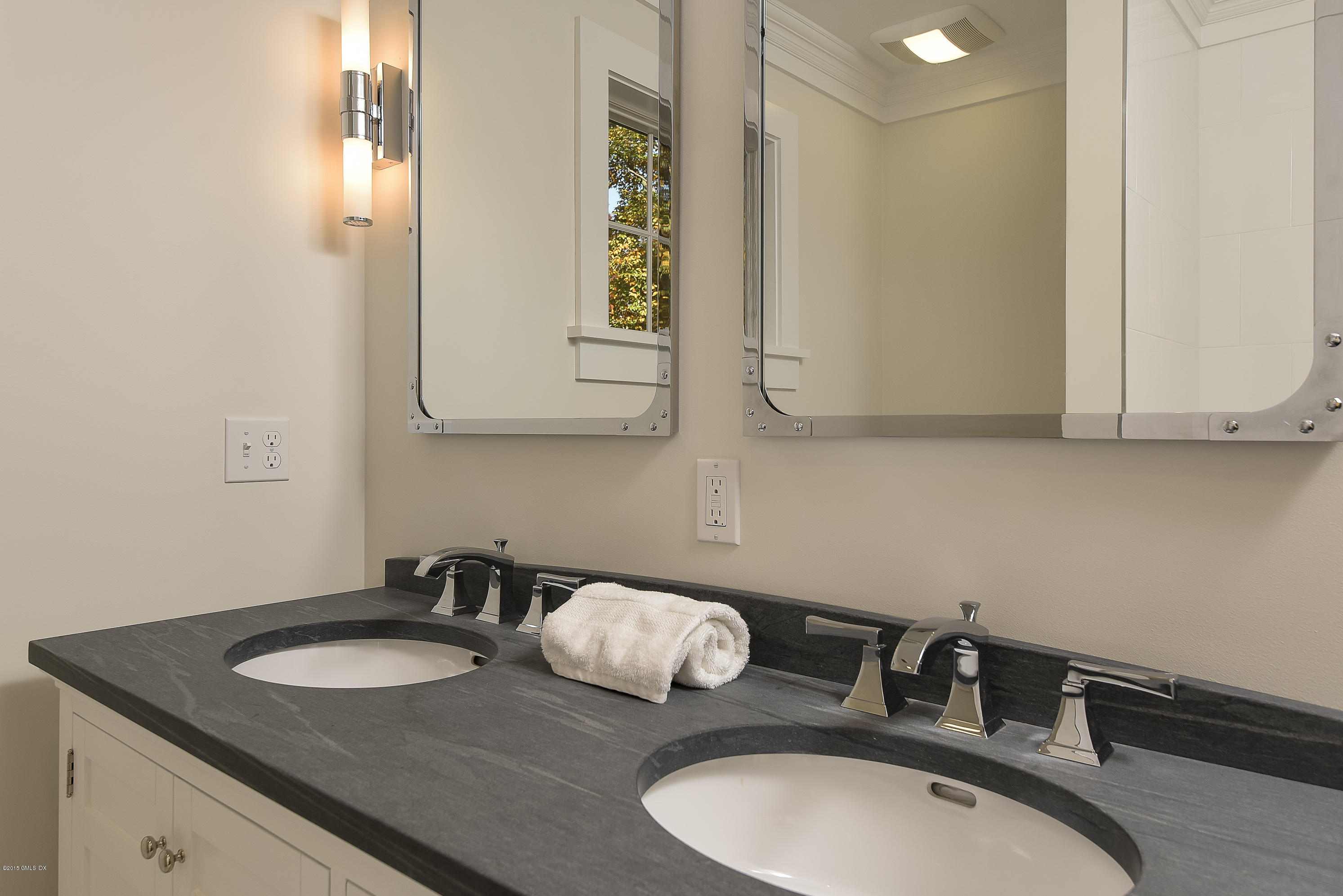 30 Edgewood Road Darien, CT 06820 - Photo 27 of 28 a bathroom with a sink and a mirror