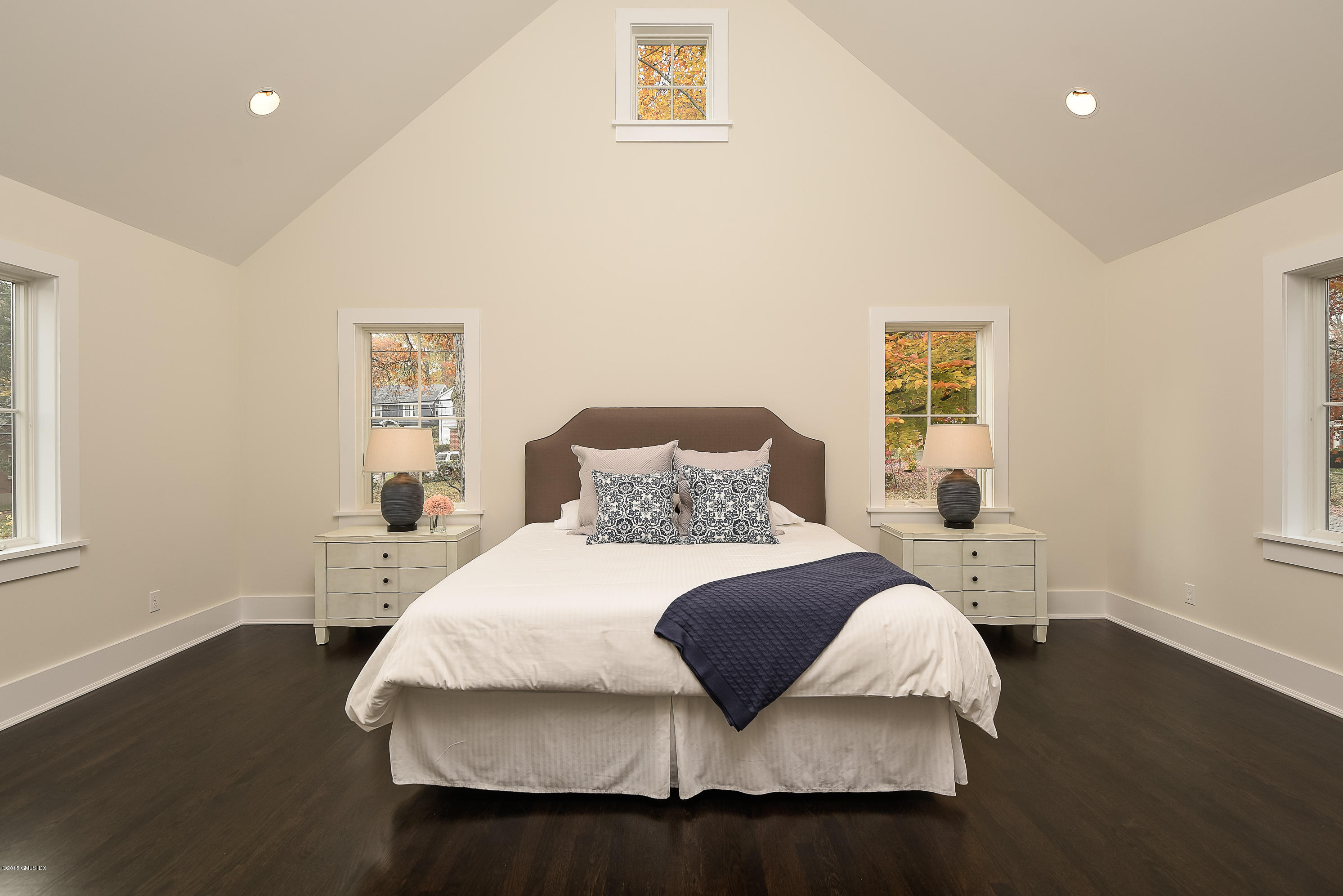 30 Edgewood Road Darien, CT 06820 - Photo 5 of 28 a bedroom with a bed and wooden floor