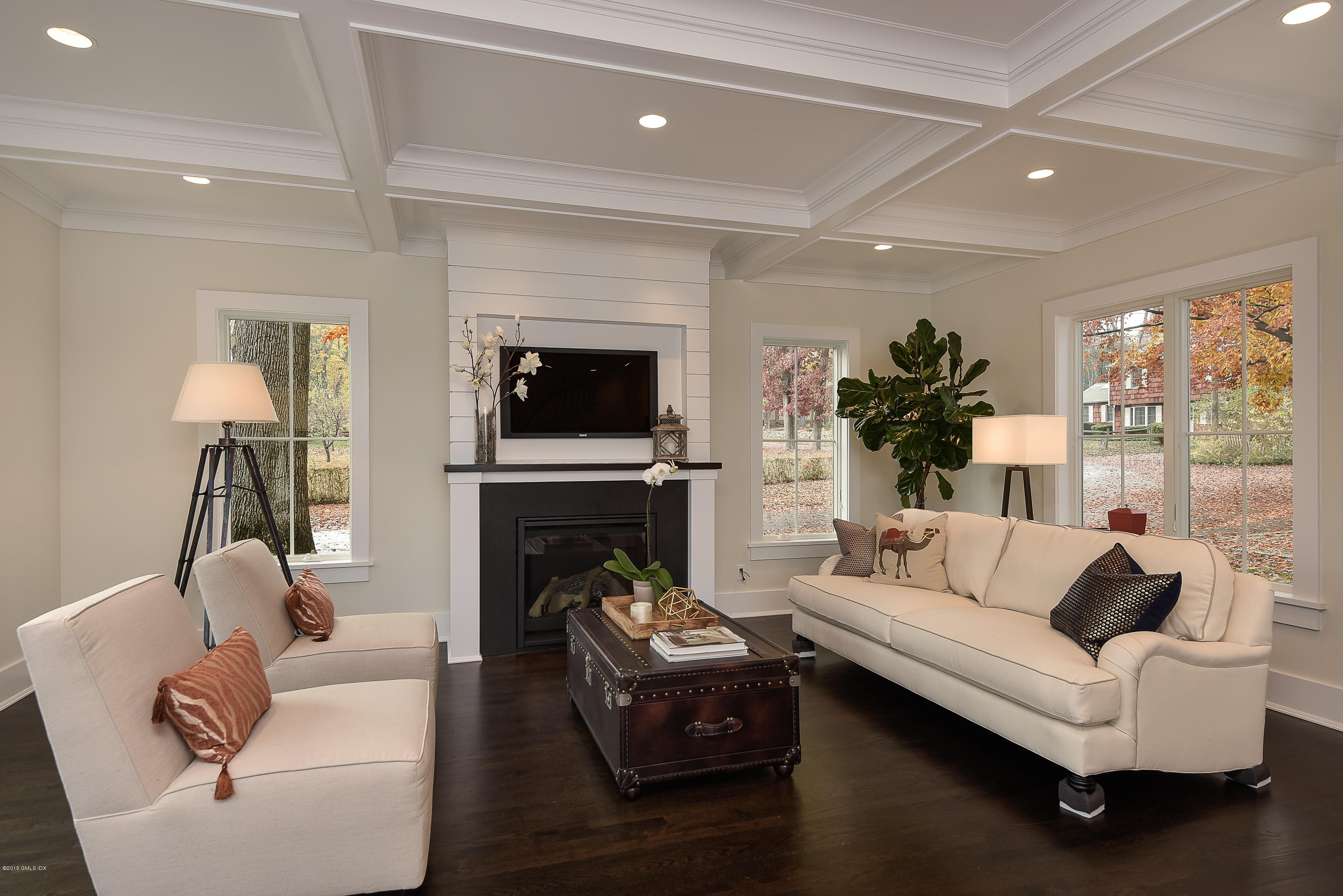 30 Edgewood Road Darien, CT 06820 - Photo 9 of 28 a living room with furniture a fireplace and a flat screen tv