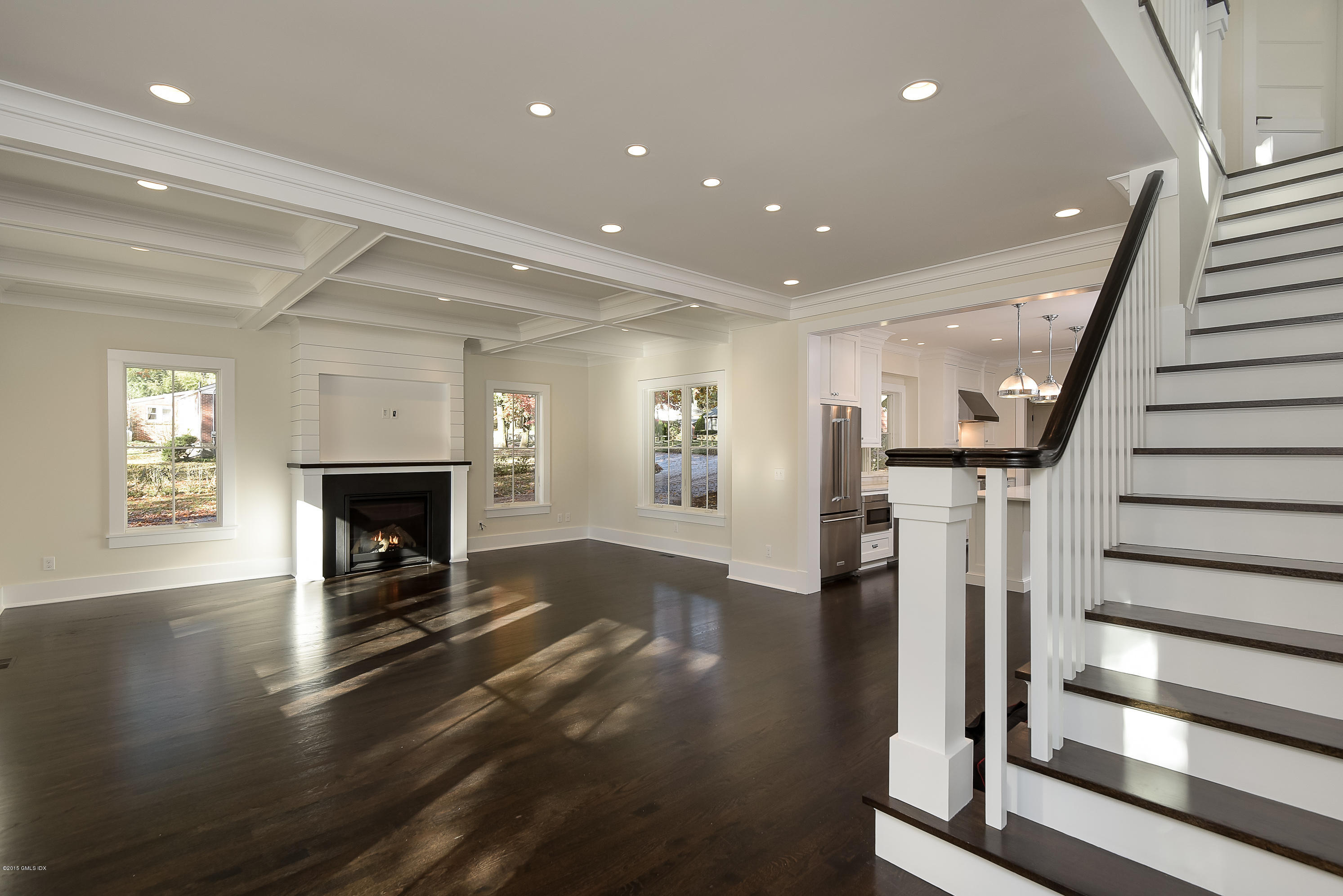 30 Edgewood Road Darien, CT 06820 - Photo 10 of 28 a view of a livingroom with wooden floor fireplace and stairs