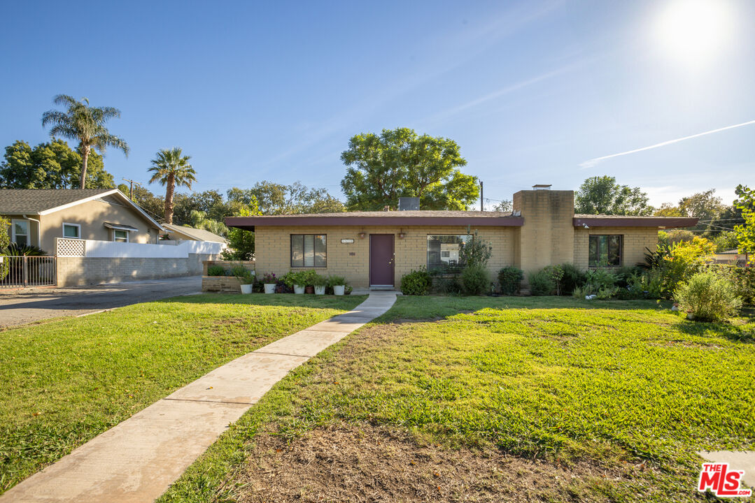4620 Cover Street Riverside, CA 92506 - Photo 1 of 42 a front view of a house with a yard