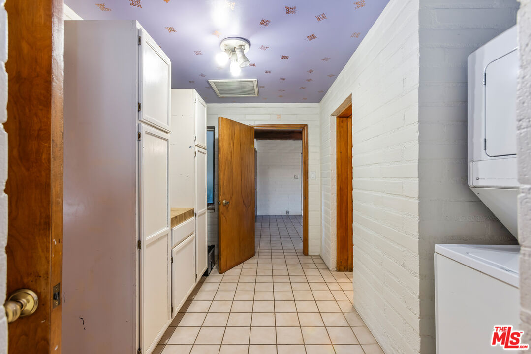 4620 Cover Street Riverside, CA 92506 - Photo 14 of 42 a view of a hallway with wooden floor and staircase