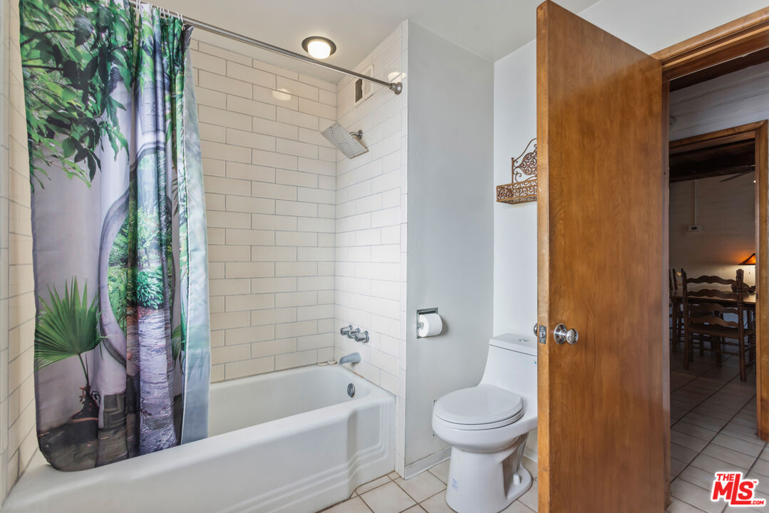 4620 Cover Street Riverside, CA 92506 - Photo 25 of 42 a bathroom with a toilet and a shower