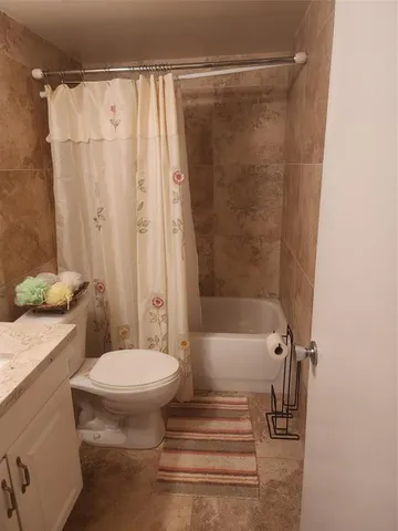 a bedroom with bed and cupboard