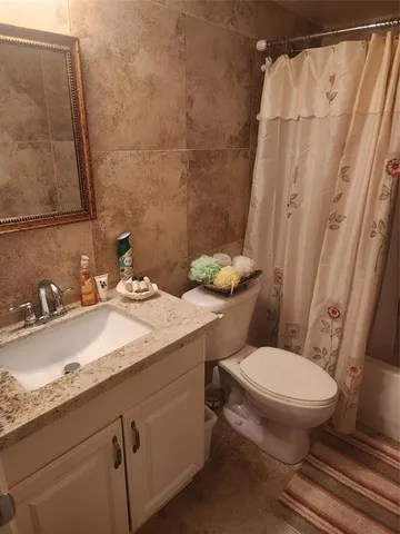 a bedroom with bed and cupboard