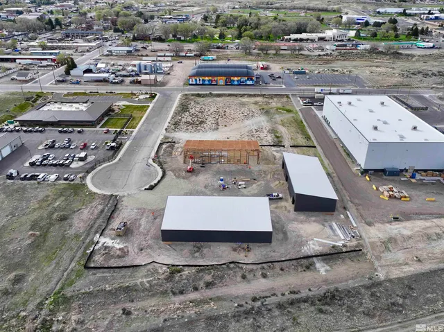 an aerial view of a house with a swimming pool