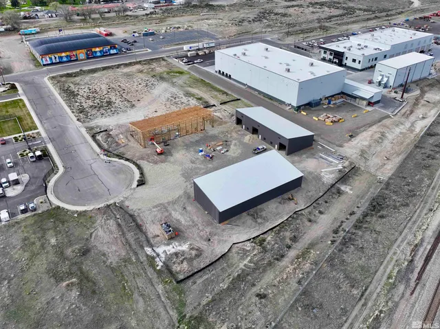 an aerial view of a residential houses with outdoor space