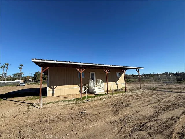 a view of back yard of a house