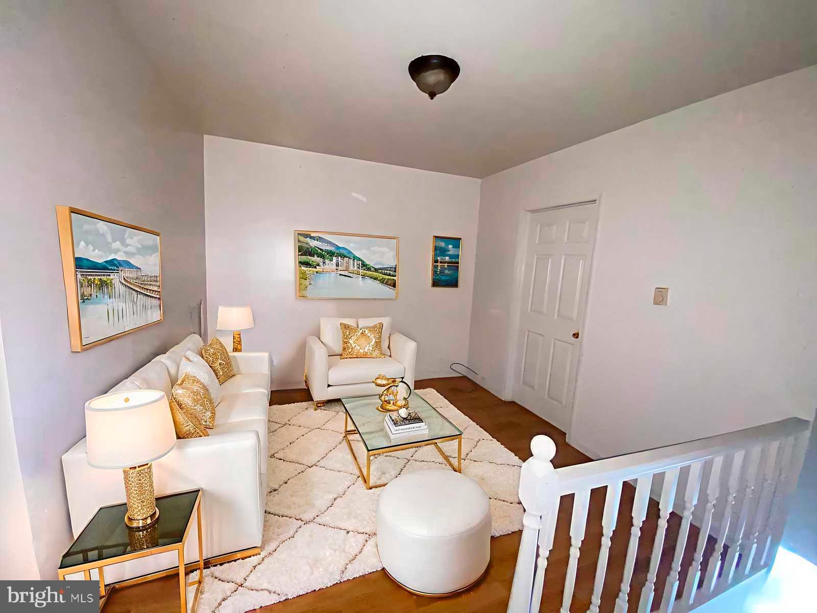 2832 Ormes Street Philadelphia, PA 19134 - Photo 14 of 28 a living room with furniture and a window