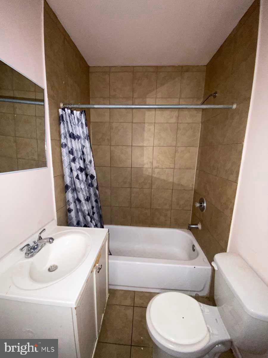 2832 Ormes Street Philadelphia, PA 19134 - Photo 22 of 28 a bathroom with a sink a toilet and bathtub