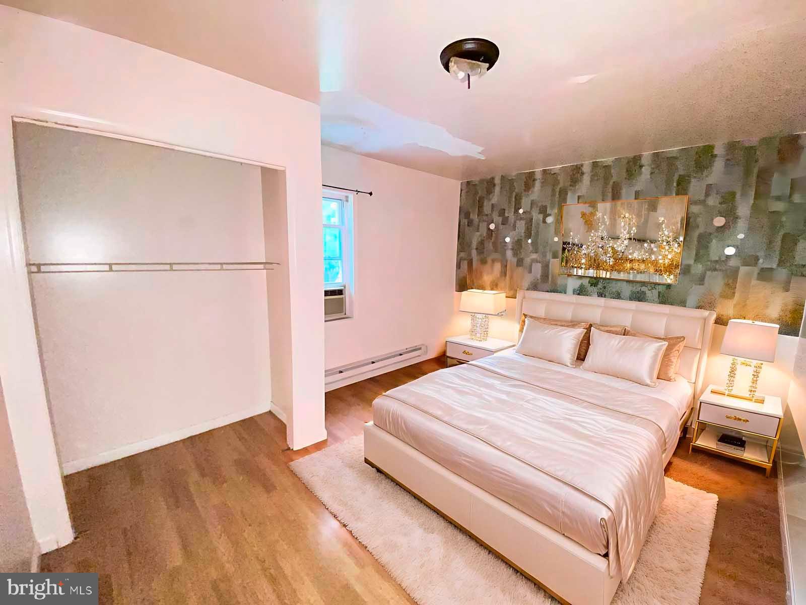 2832 Ormes Street Philadelphia, PA 19134 - Photo 23 of 28 a bedroom with a large bed and a large window