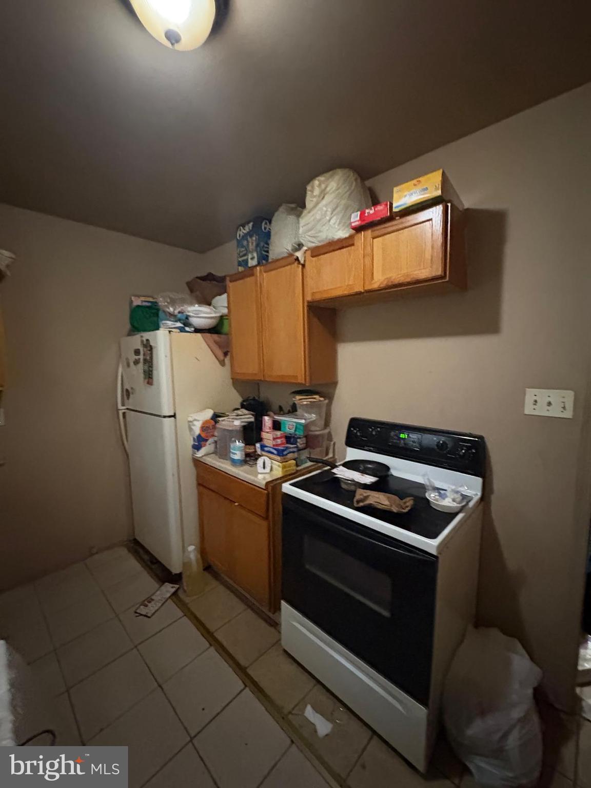 2832 Ormes Street Philadelphia, PA 19134 - Photo 10 of 28 a kitchen with a stove and a refrigerator