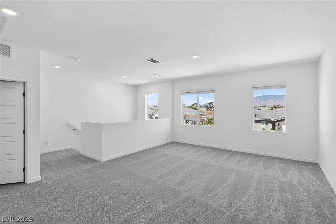 347 Sam Way Mesquite, NV 89027 - Photo 28 of 32 A spacious, naturally illuminated loft area offers serene views and versatile living potential.