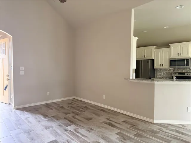 a view of a kitchen with a sink and dishwasher