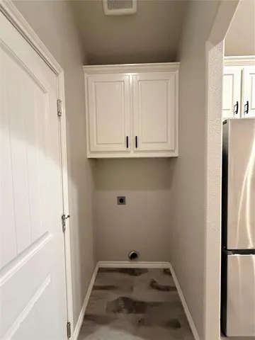 a view of a storage and utility room with closet
