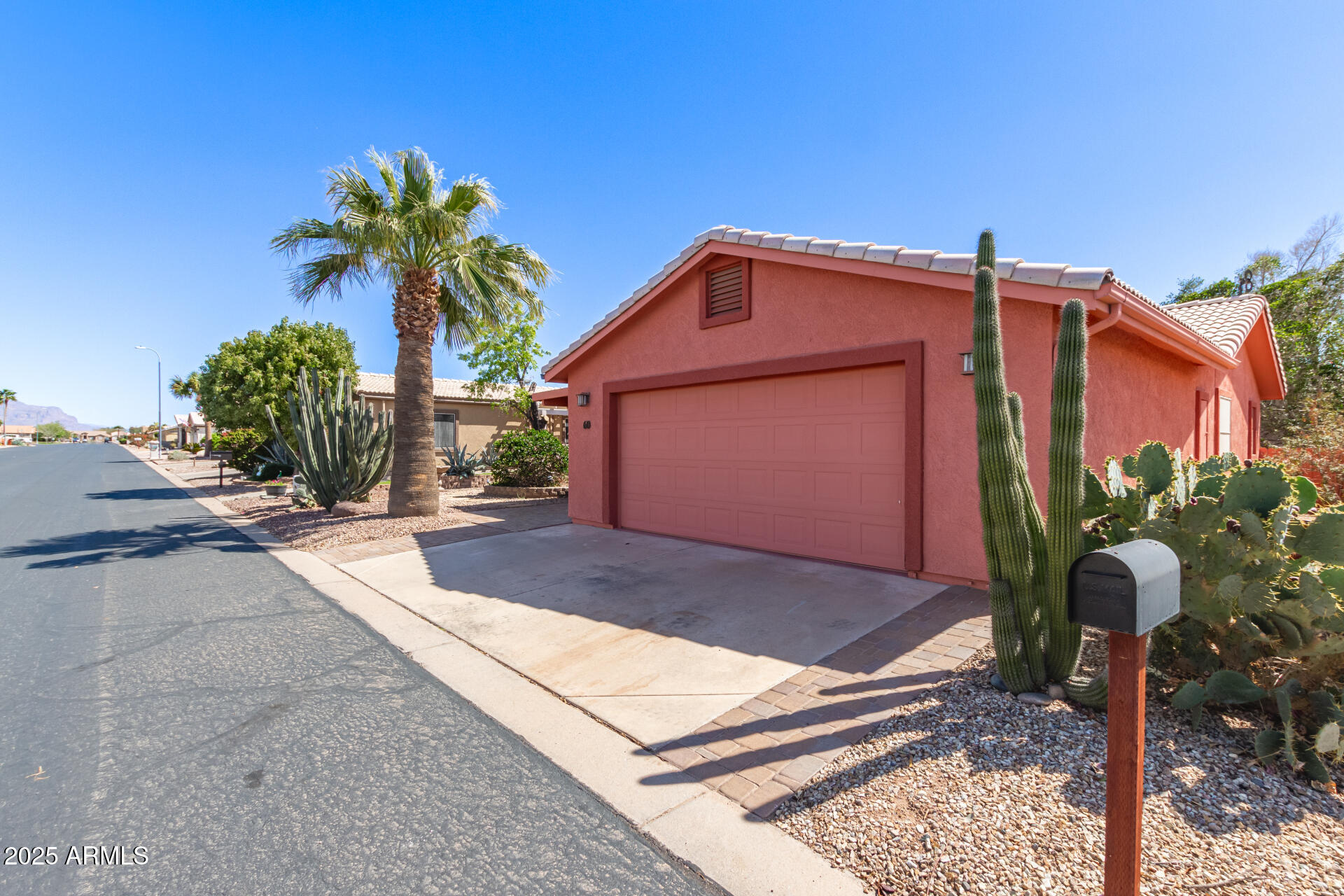 2101 South Meridian Road, Unit 60 Apache Junction, AZ 85120 - Photo 2 of 35 a front view of a house with garden