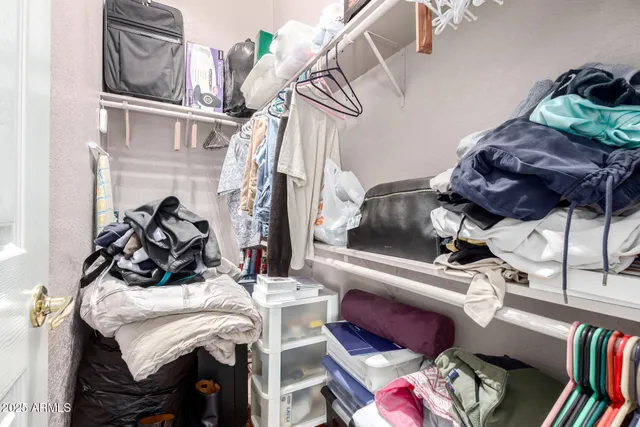 a bed room with a bed and a chandelier