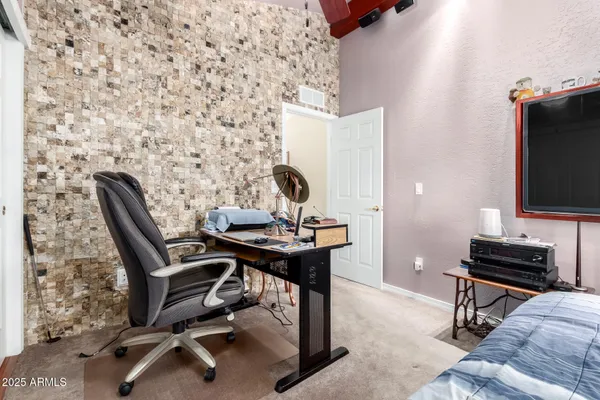 a view of a workspace with furniture