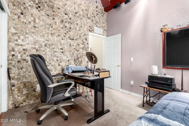 a view of a workspace with furniture