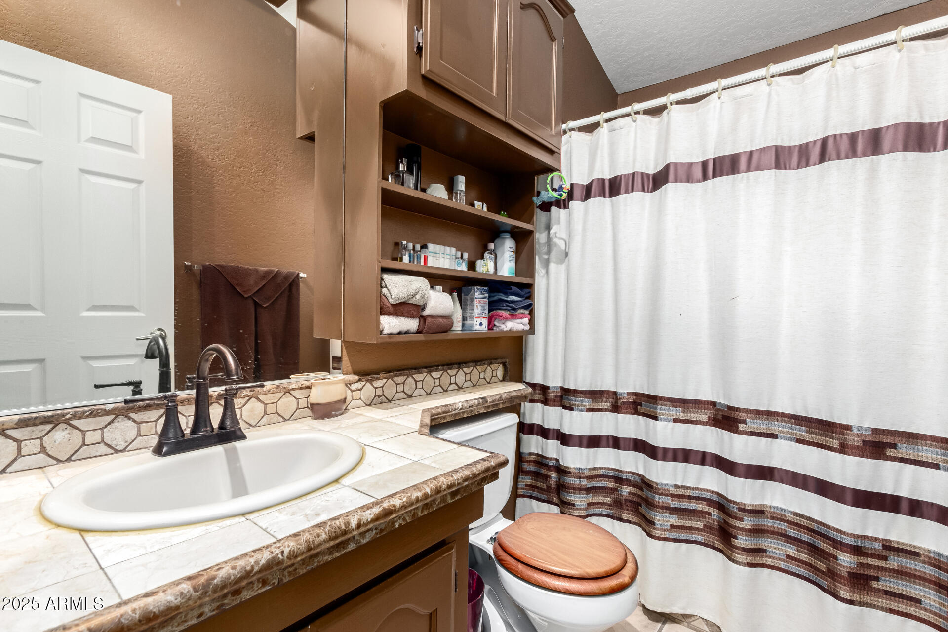 2101 South Meridian Road, Unit 60 Apache Junction, AZ 85120 - Photo 25 of 35 a bathroom with a granite countertop sink and a mirror