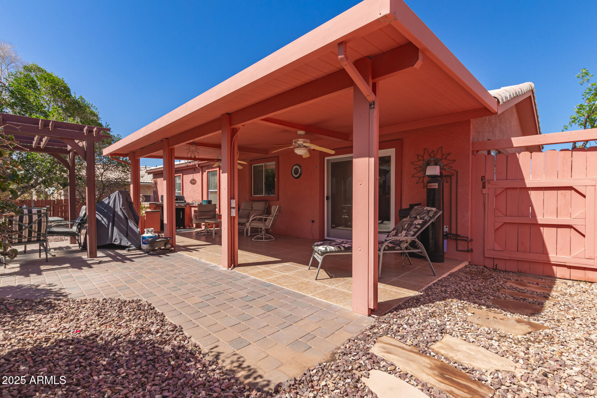 2101 South Meridian Road, Unit 60 Apache Junction, AZ 85120 - Photo 30 of 35 a view of a wooden chairs and a table in a patio