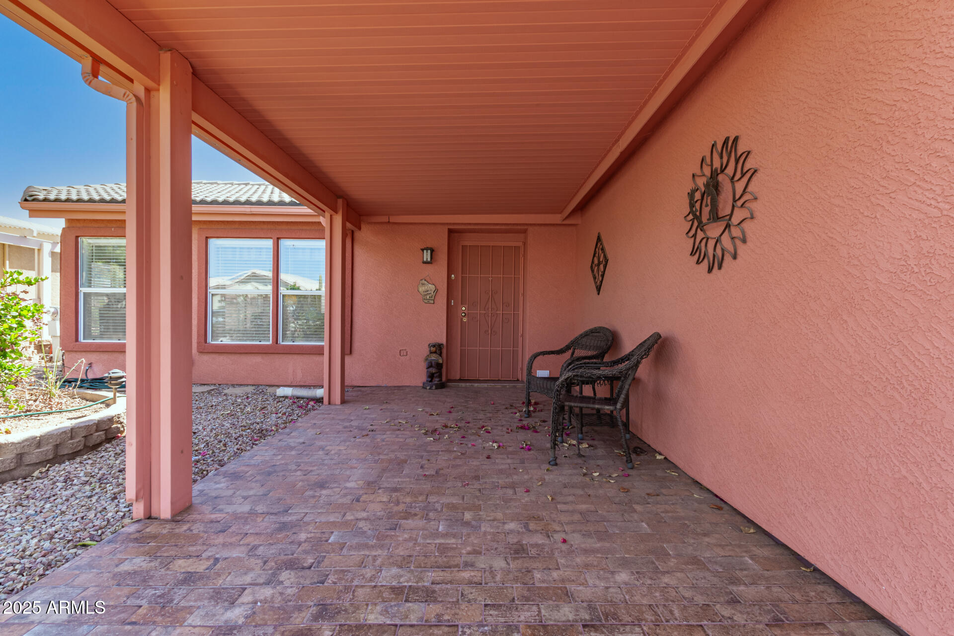 2101 South Meridian Road, Unit 60 Apache Junction, AZ 85120 - Photo 7 of 35 a backyard of a house with outdoor seating